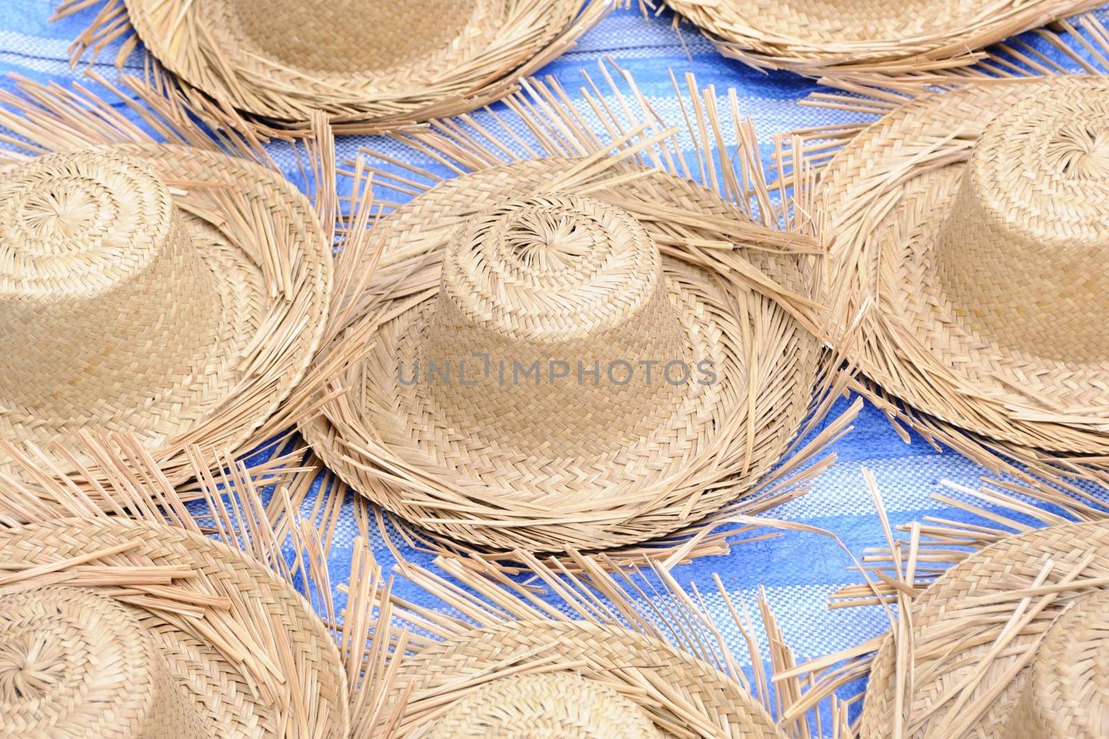 Straw hat in local market. by ngungfoto