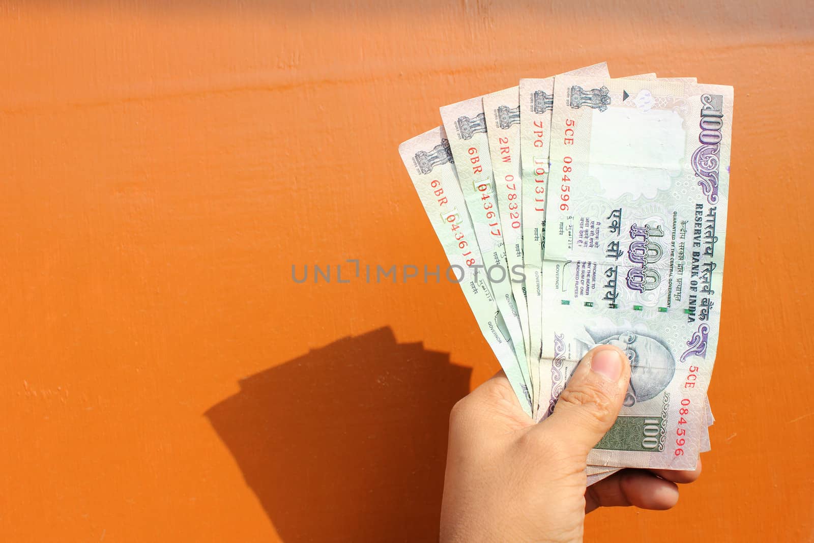 indian money with wooden background