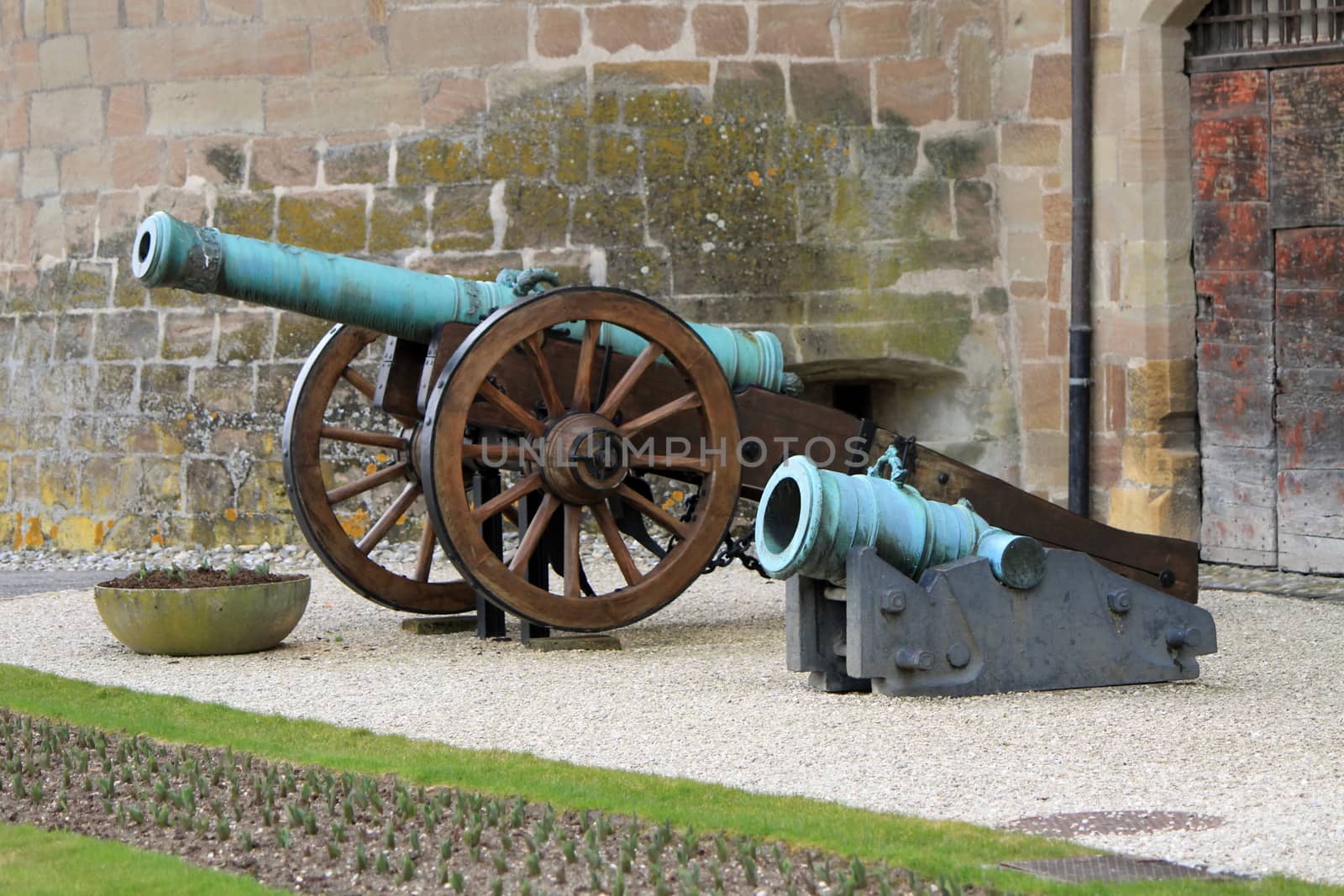 Two medieval canons standing at the entrance of middle ages castle, Morges, Switzerland