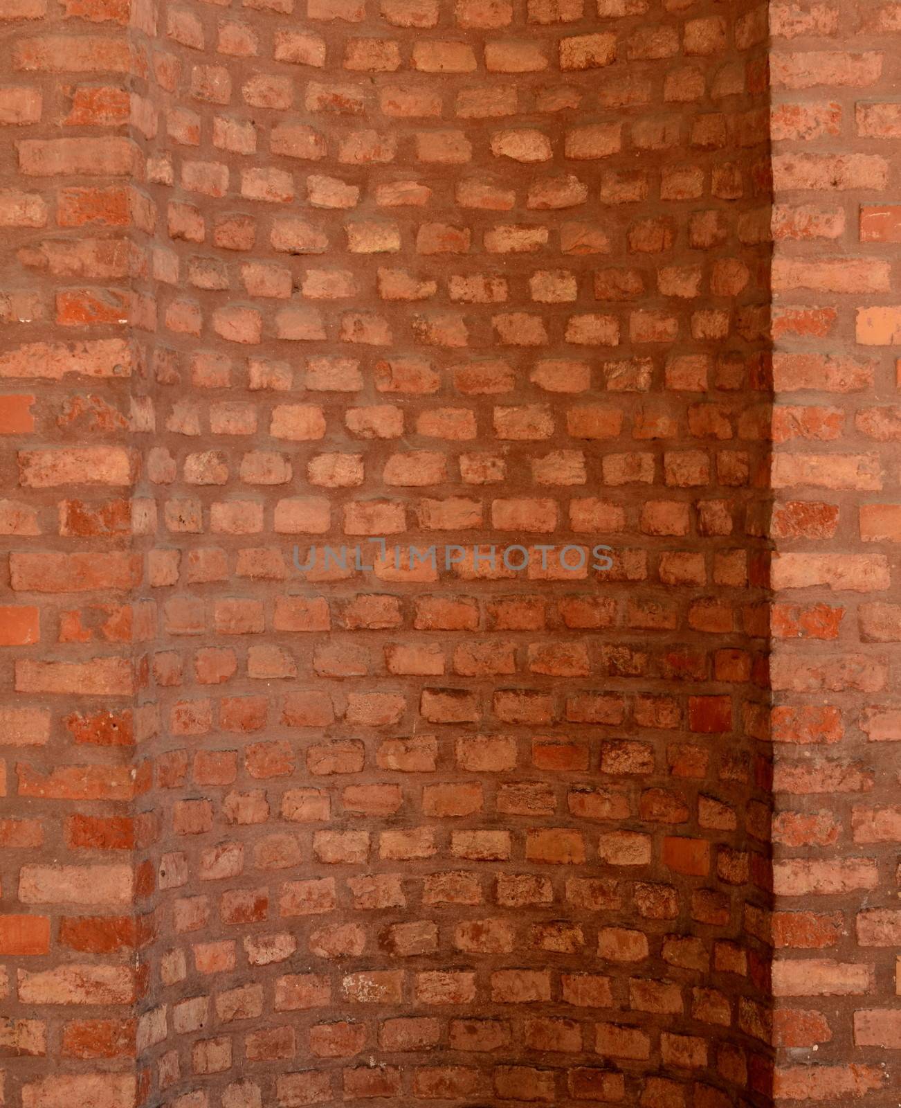 Architectural Feature Of A Curved Red Brick Wall For A Chimney