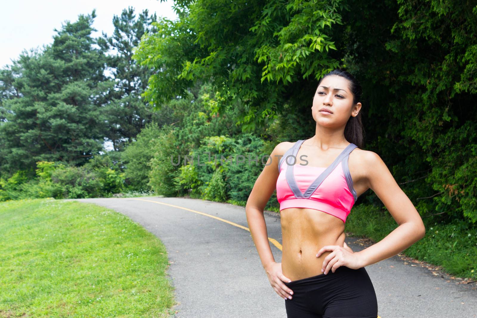 Young woman resting after running