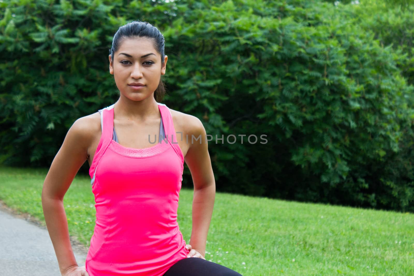 Young woman stretching before a run by bigjohn36