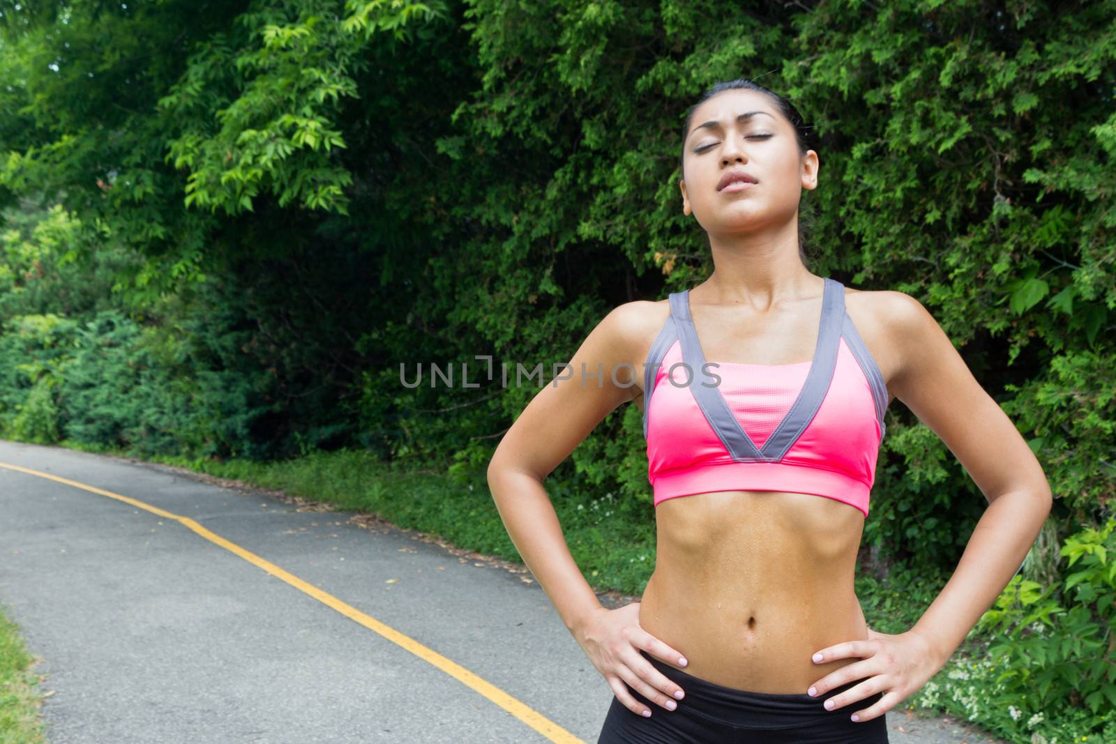 Young woman resting after running