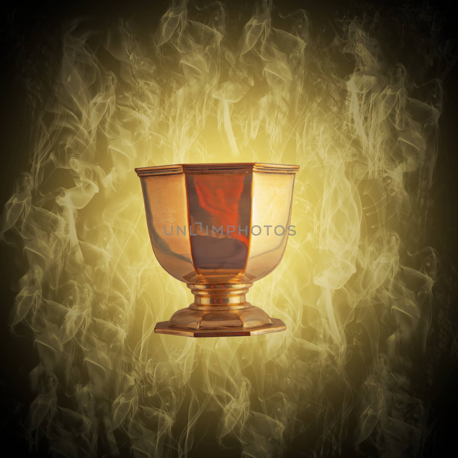 Flying golden cup with smoke and magical atmosphere