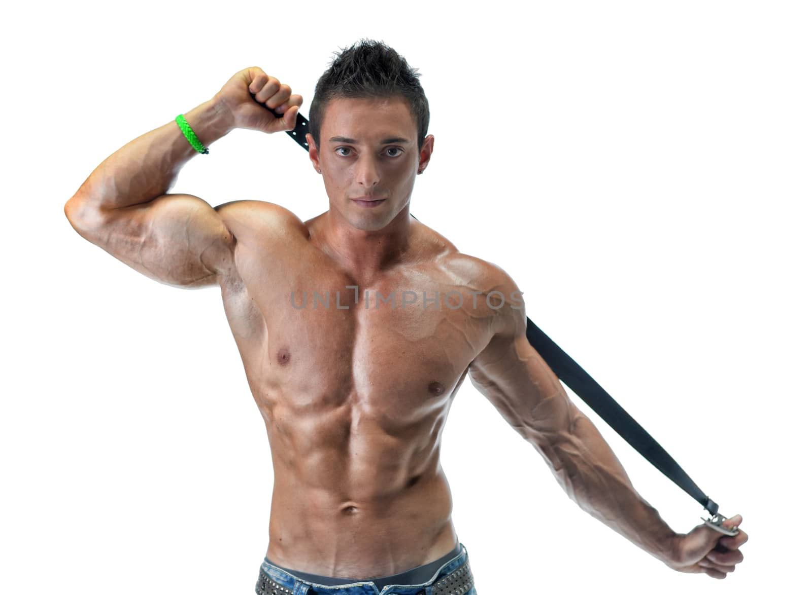 Attractive young muscle man playing with belt, isolated on white background