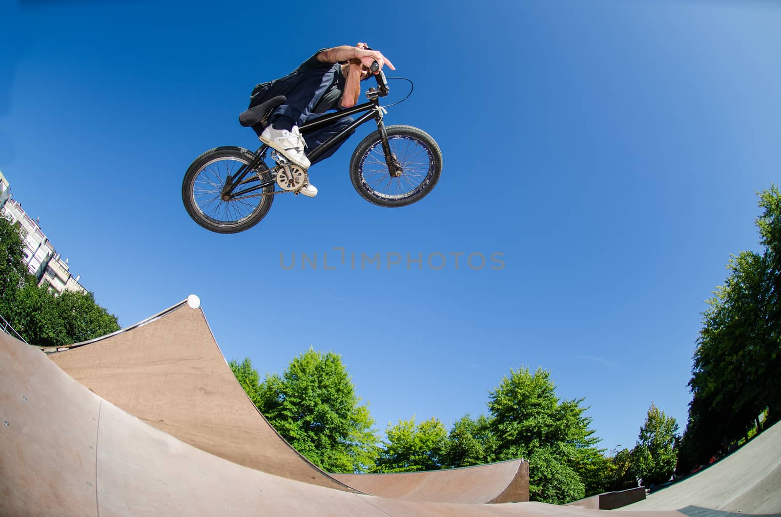 High BMX jump in a skate park.