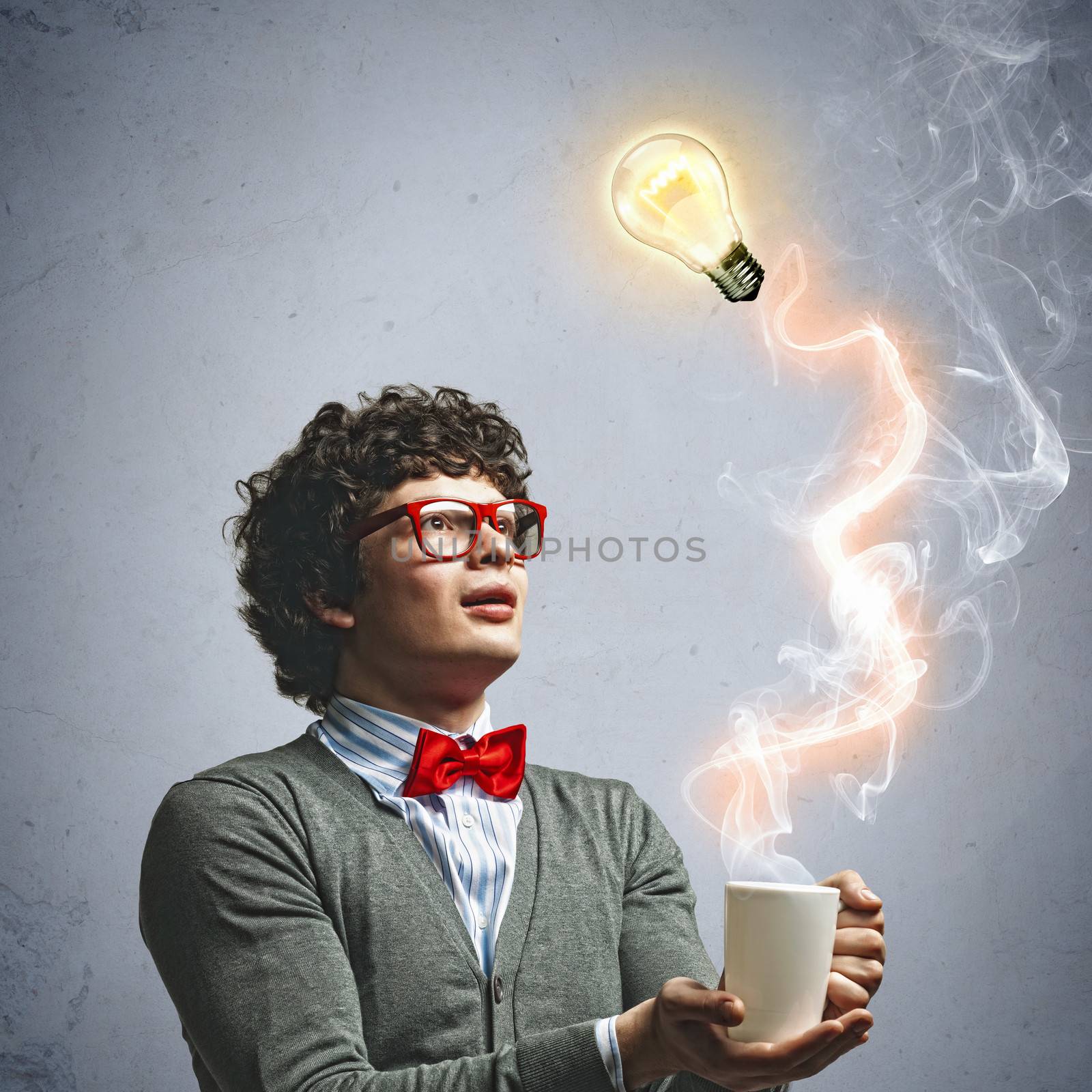 Young man with smoke coming out of a cup experimenting