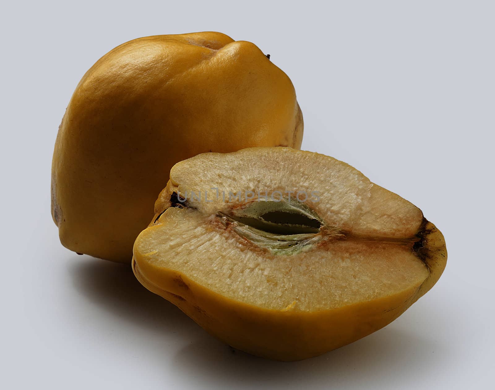 Isolated yellow quince on the grey background