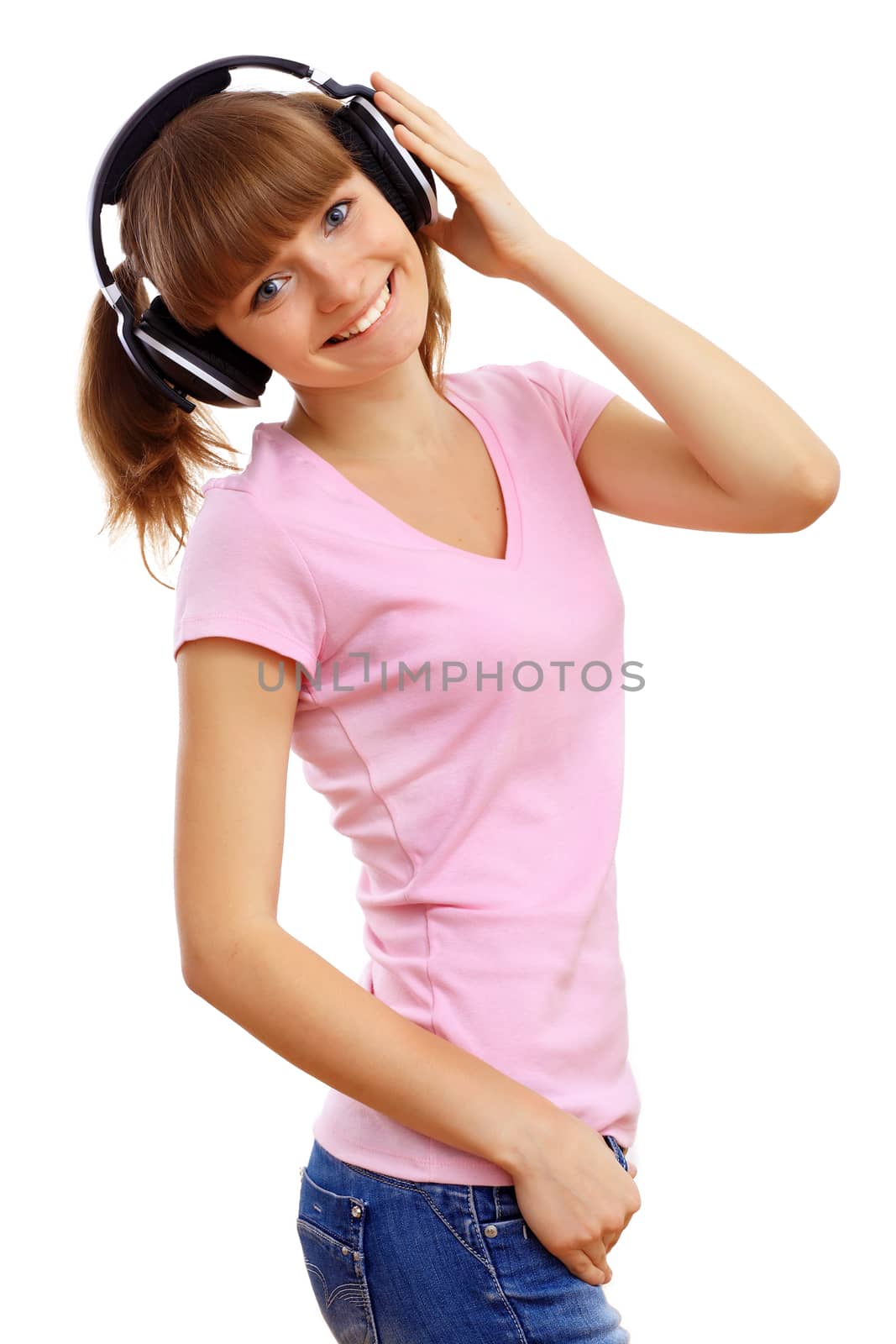 Happy smiling girl dancing and listening to music