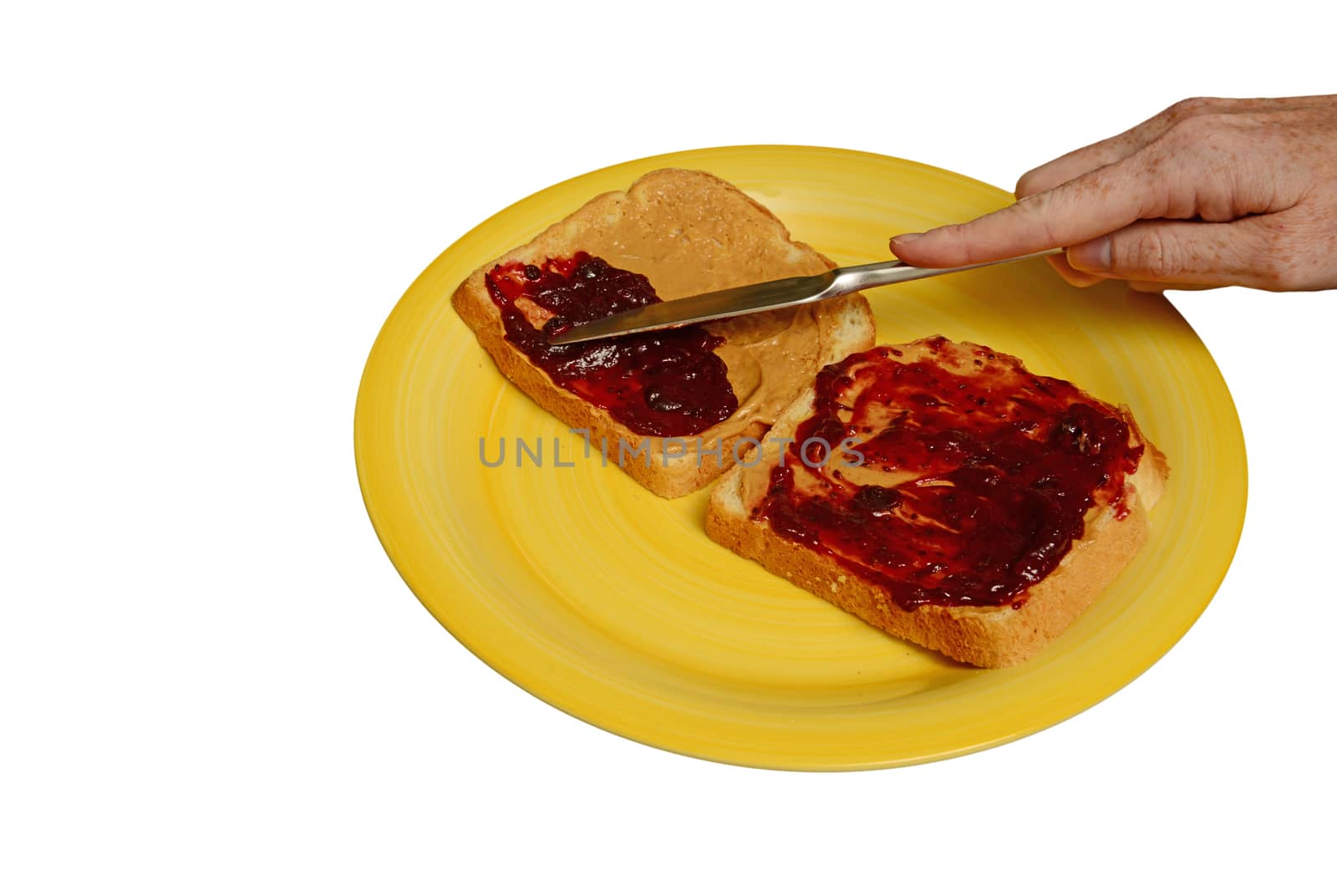 making a peanut butter and jelly sandwich on white
