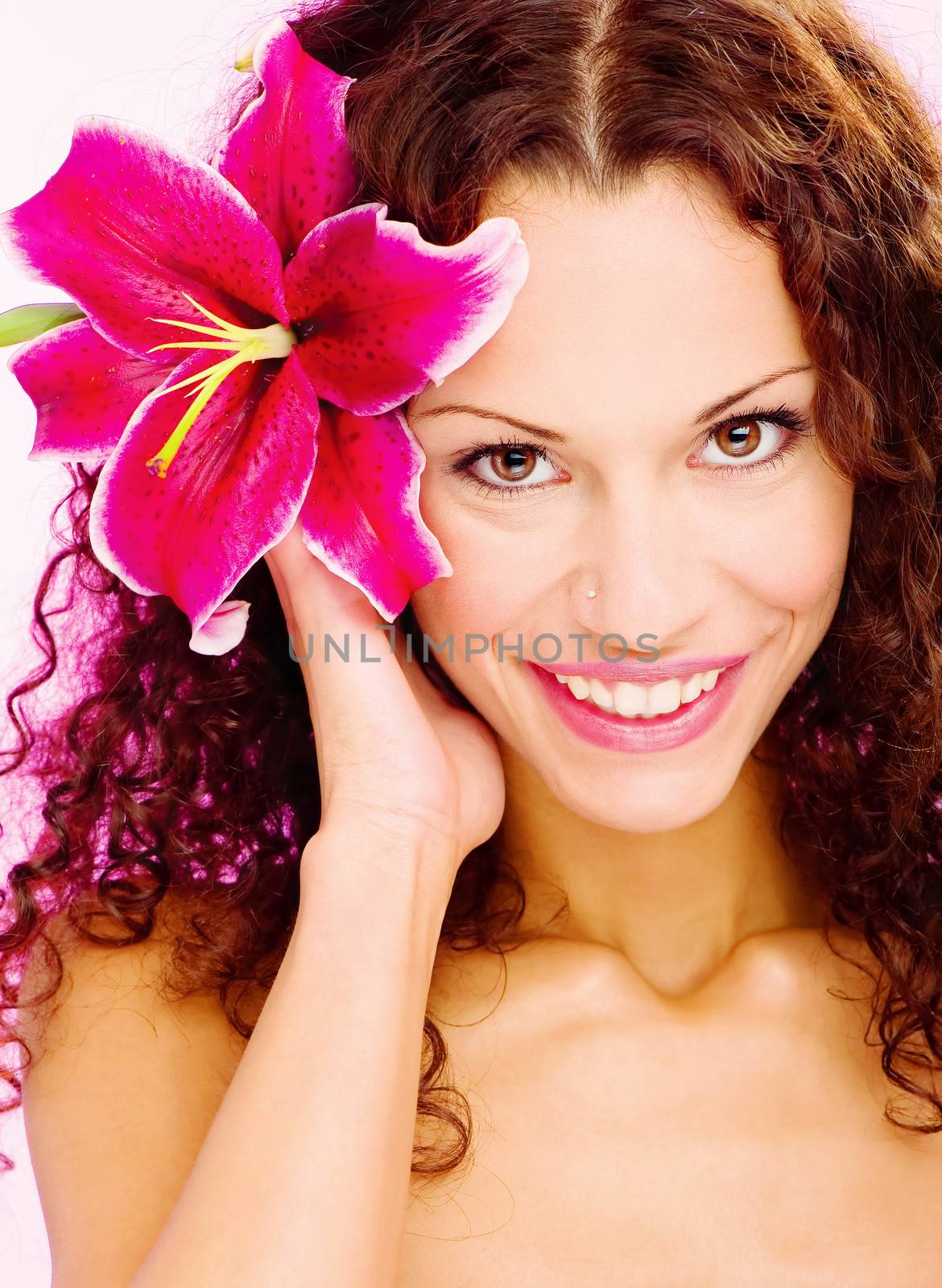 Portrait of a woman with flower in her curl hair