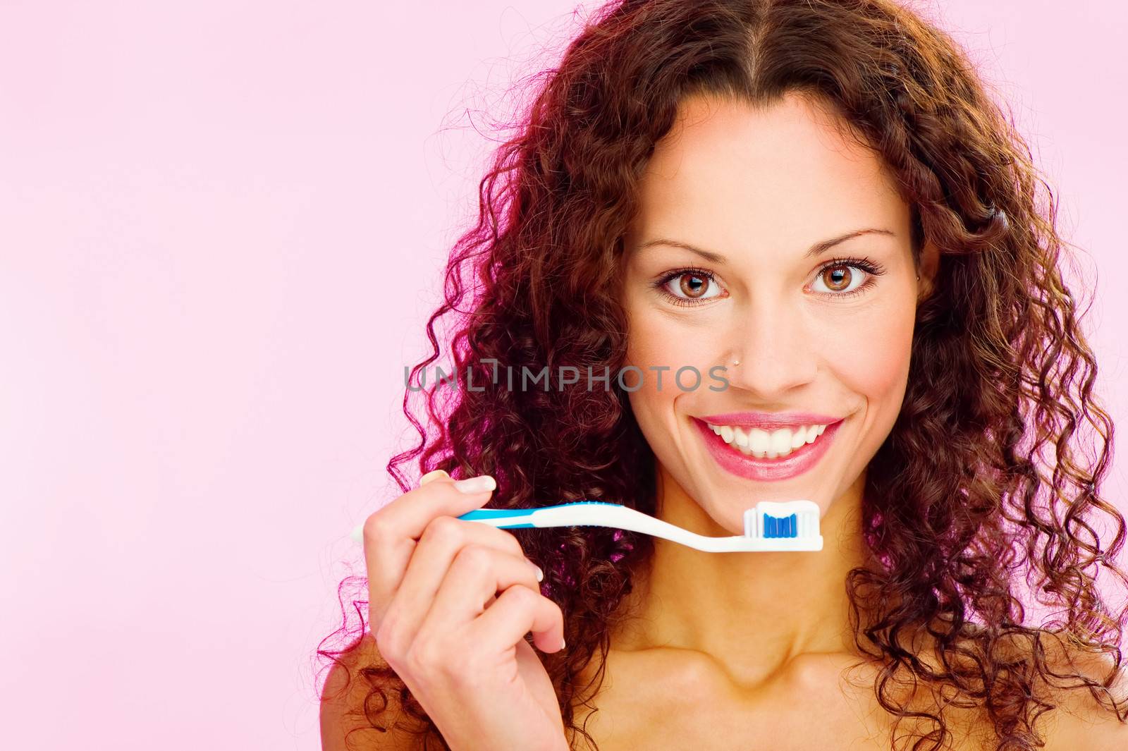 portrait of a smiling woman and teeth brush