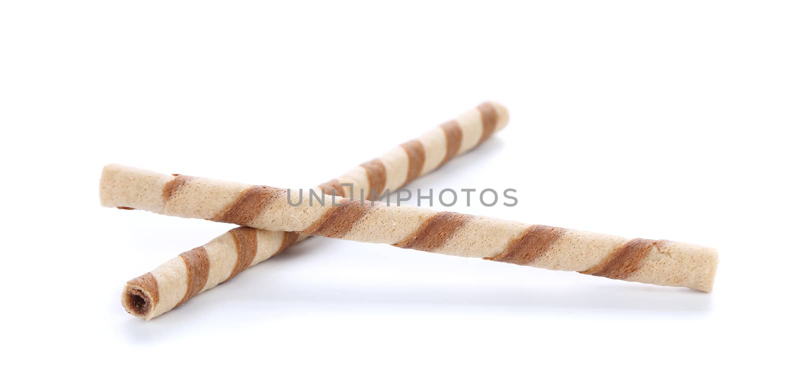 Waffle rolls with chocolate cream. Close up. White background.