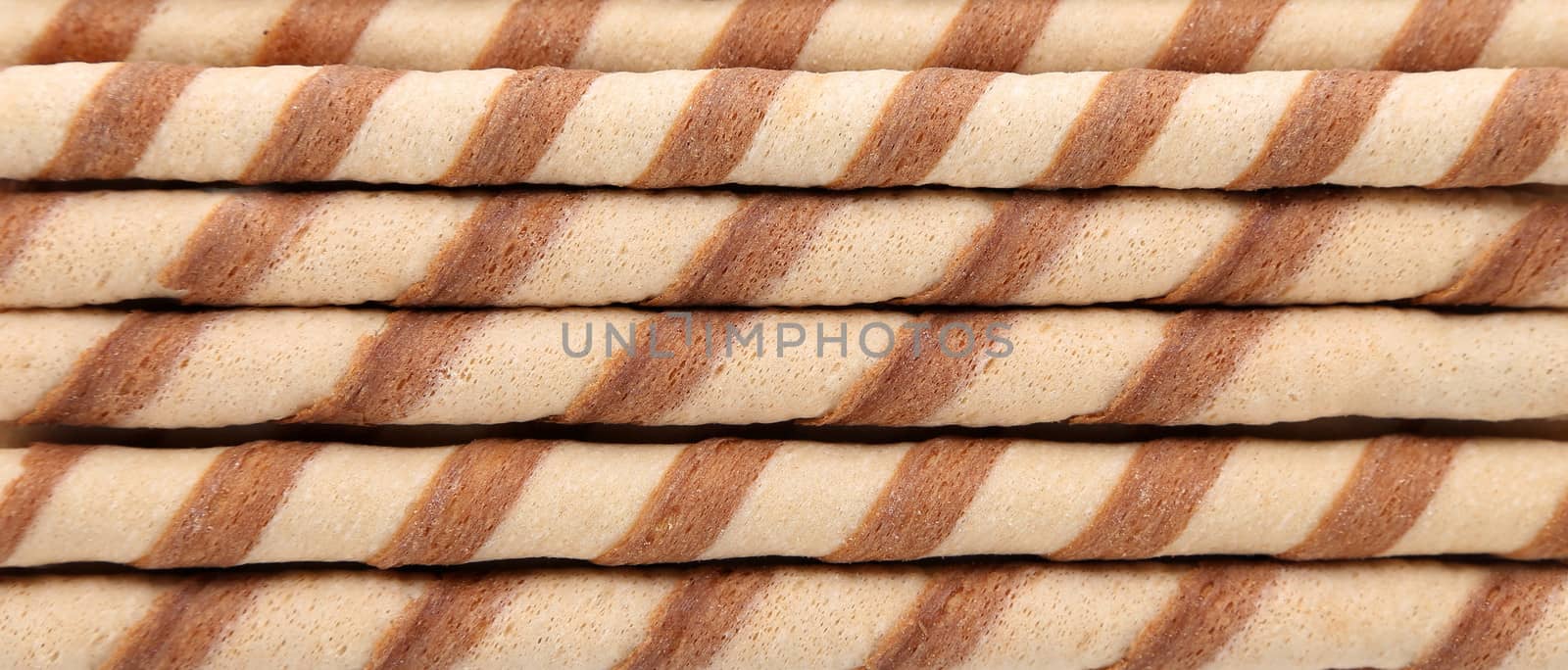 Background of waffle rolls. by indigolotos