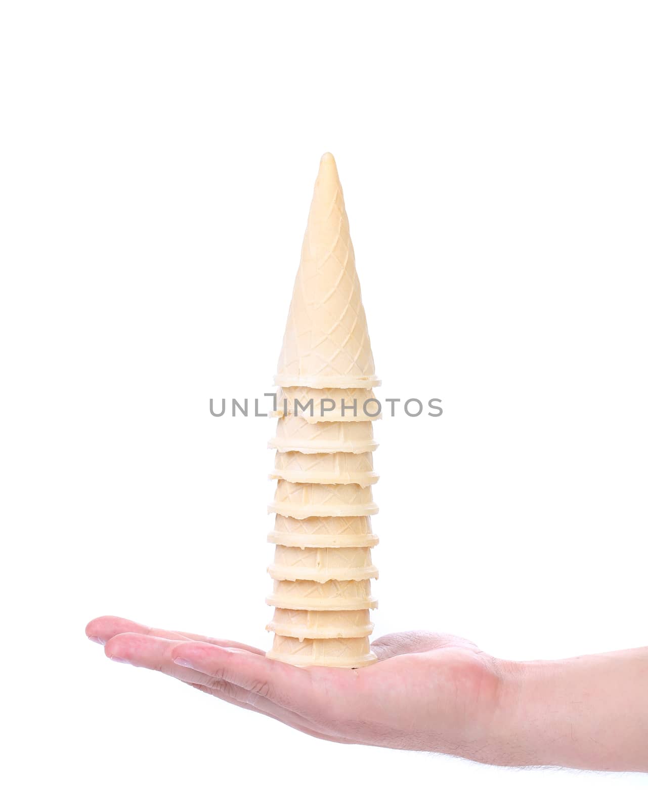 Hand hold stake of ice cream cones. White background.