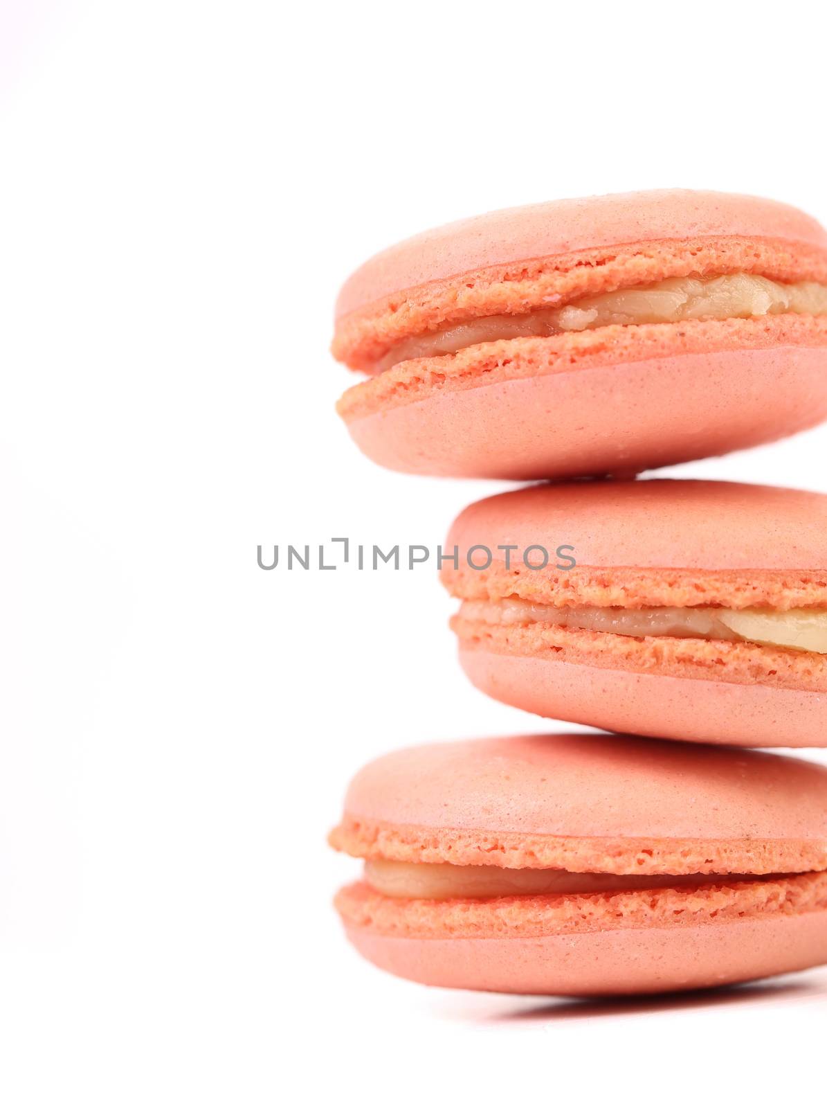Stake of various  macaron cakes. White background.