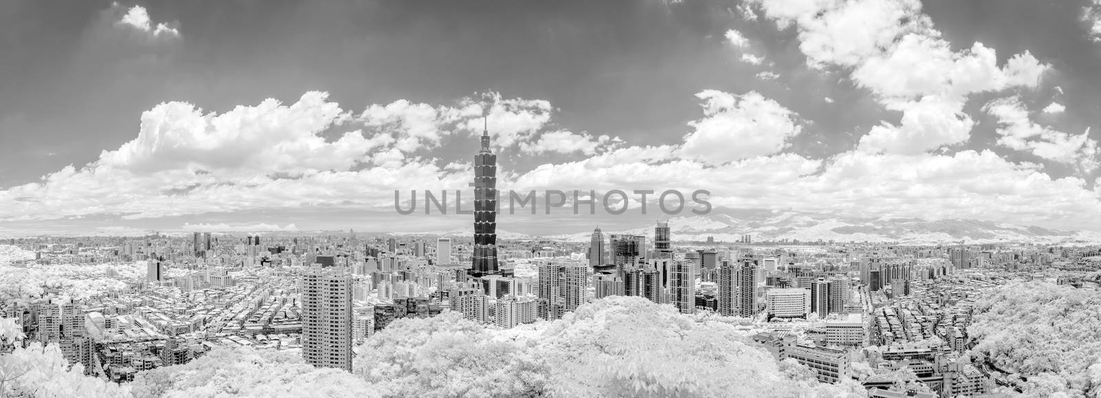 Taipei cityscape with dramatic clouds at sky, infrared photography in black and white.