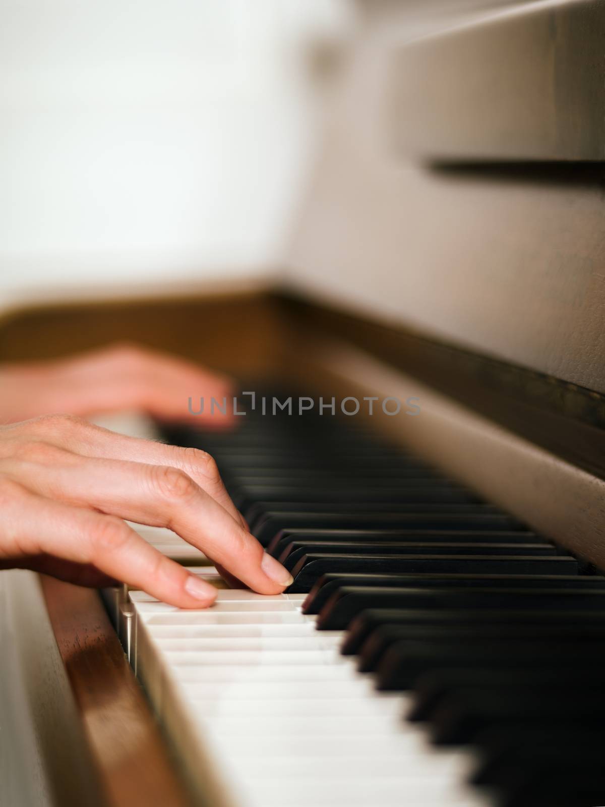 Female hands and piano keyboard by sumners