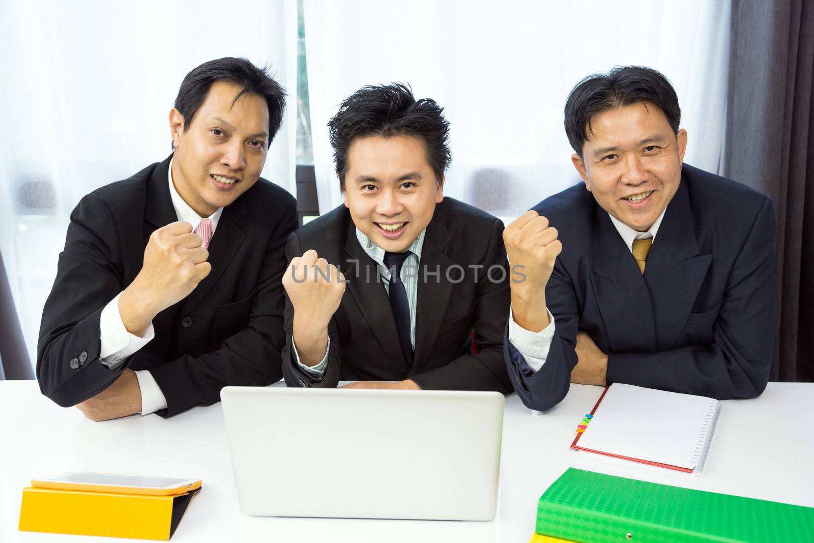 Businessmen celebrate their business success