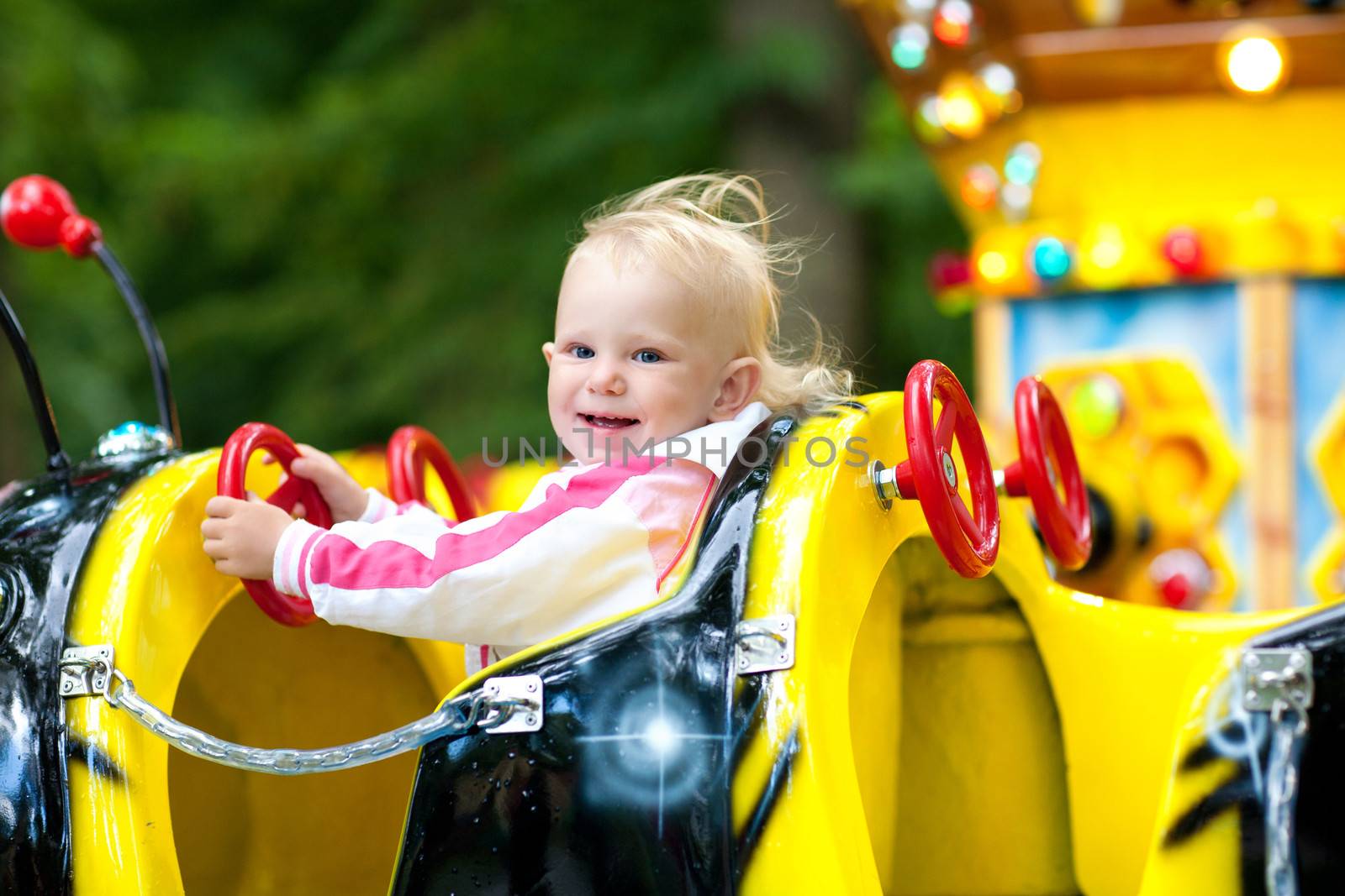 child in park of attractions