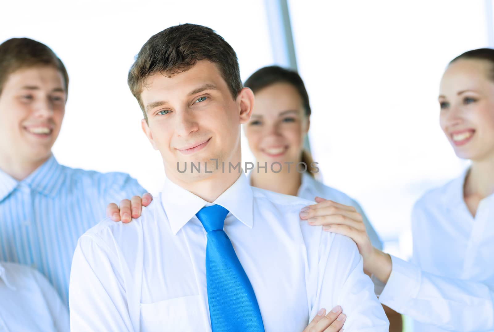 businessman receiving congratulations from his colleagues, business achievements