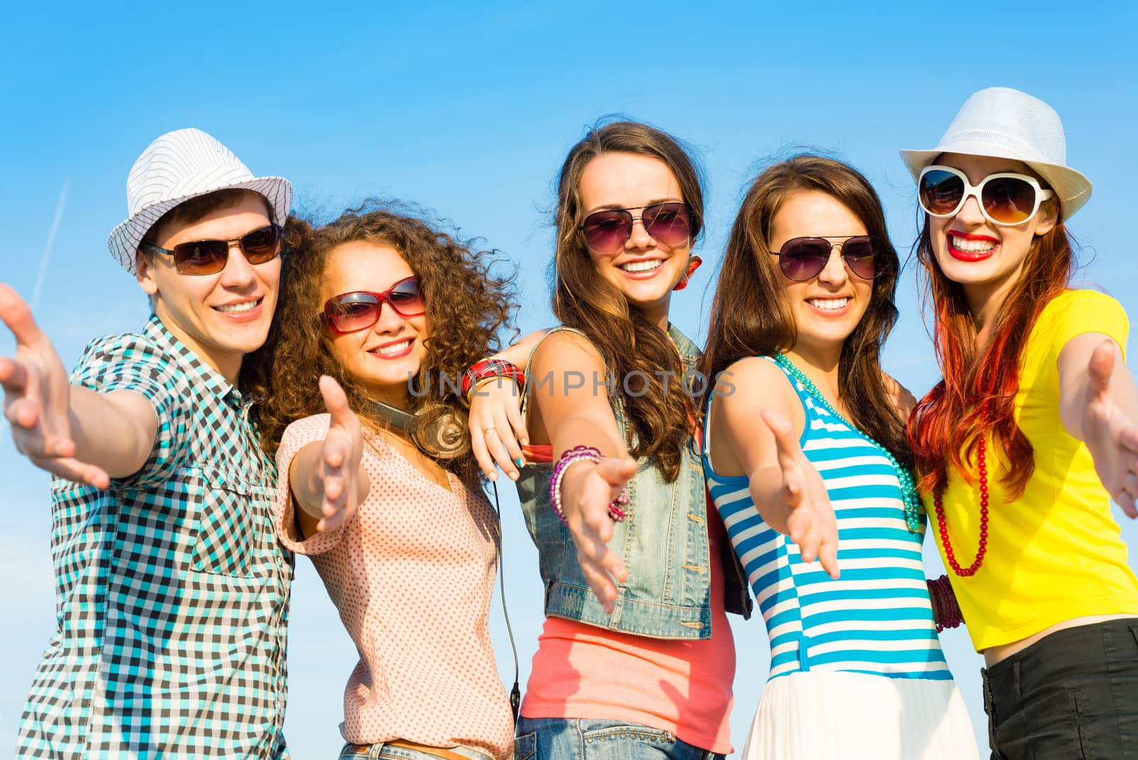 group of young people wearing sunglasses and hats hugging and standing in a row, spending time with friends