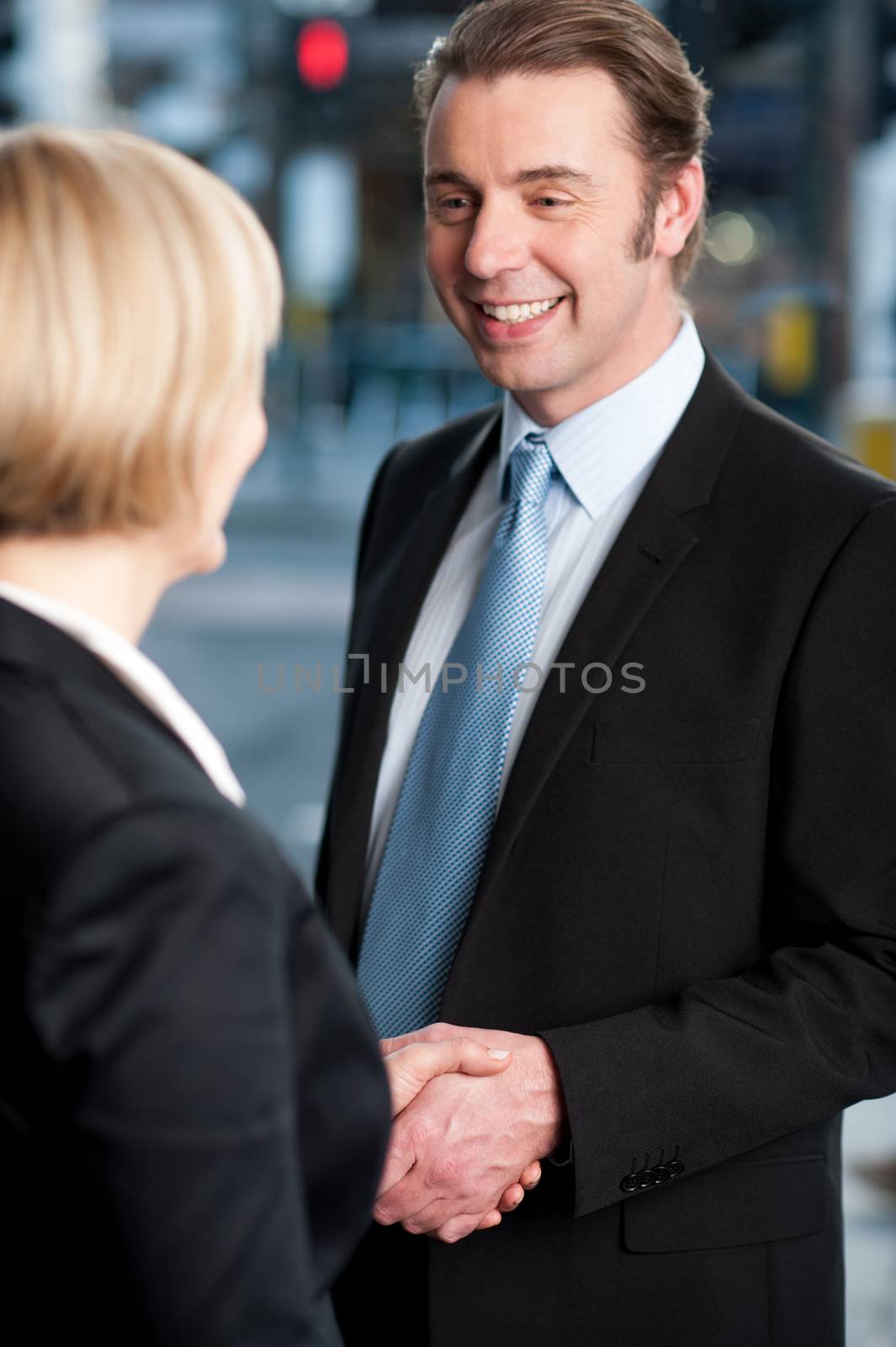 Business handshake, the deal by stockyimages
