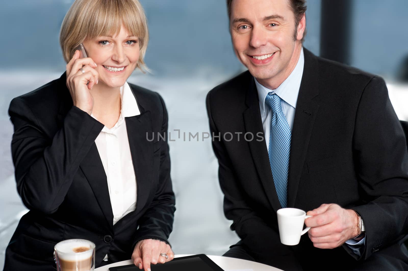 Business colleagues discussing work at break by stockyimages