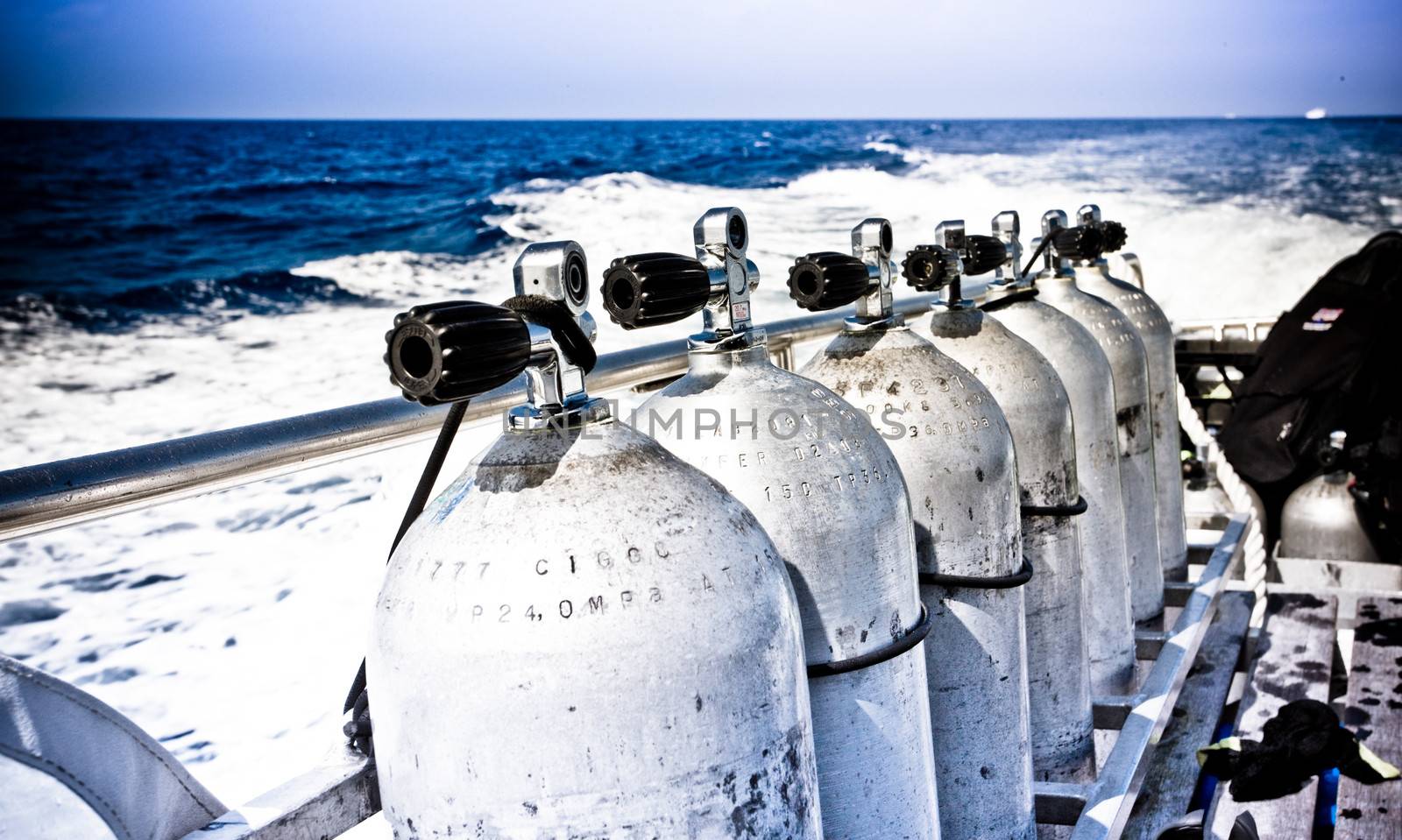 Air tanks and breathing apparatus on a boat by jrstock