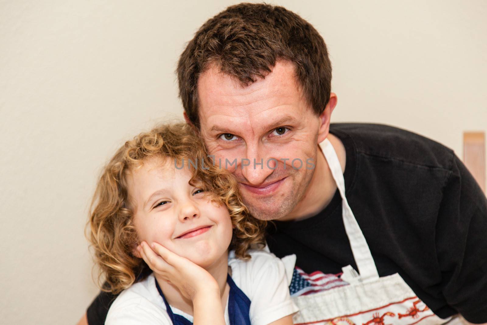 Making gingerbread house together at home before Christmas.