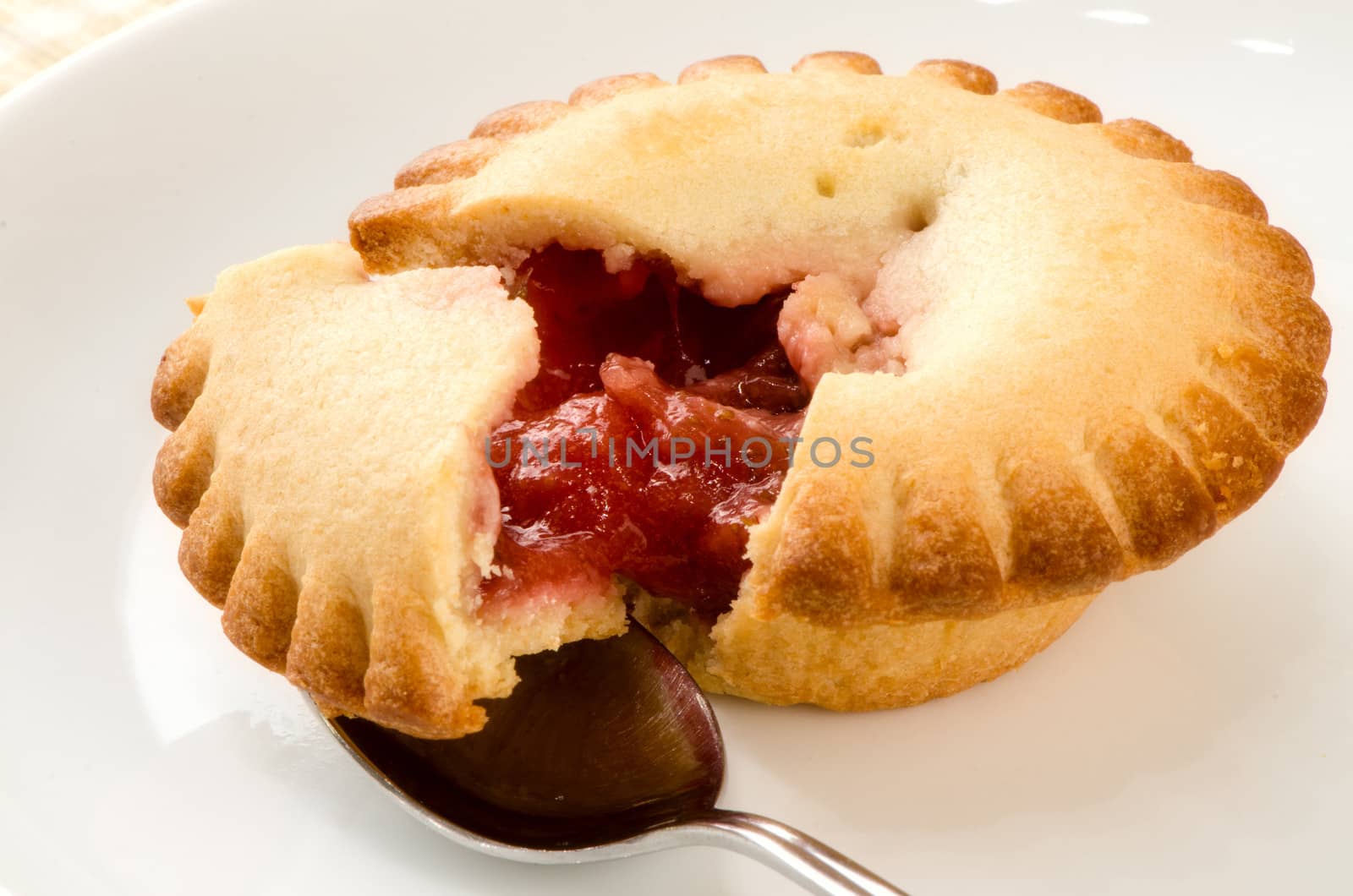 pie with berries on a plate.