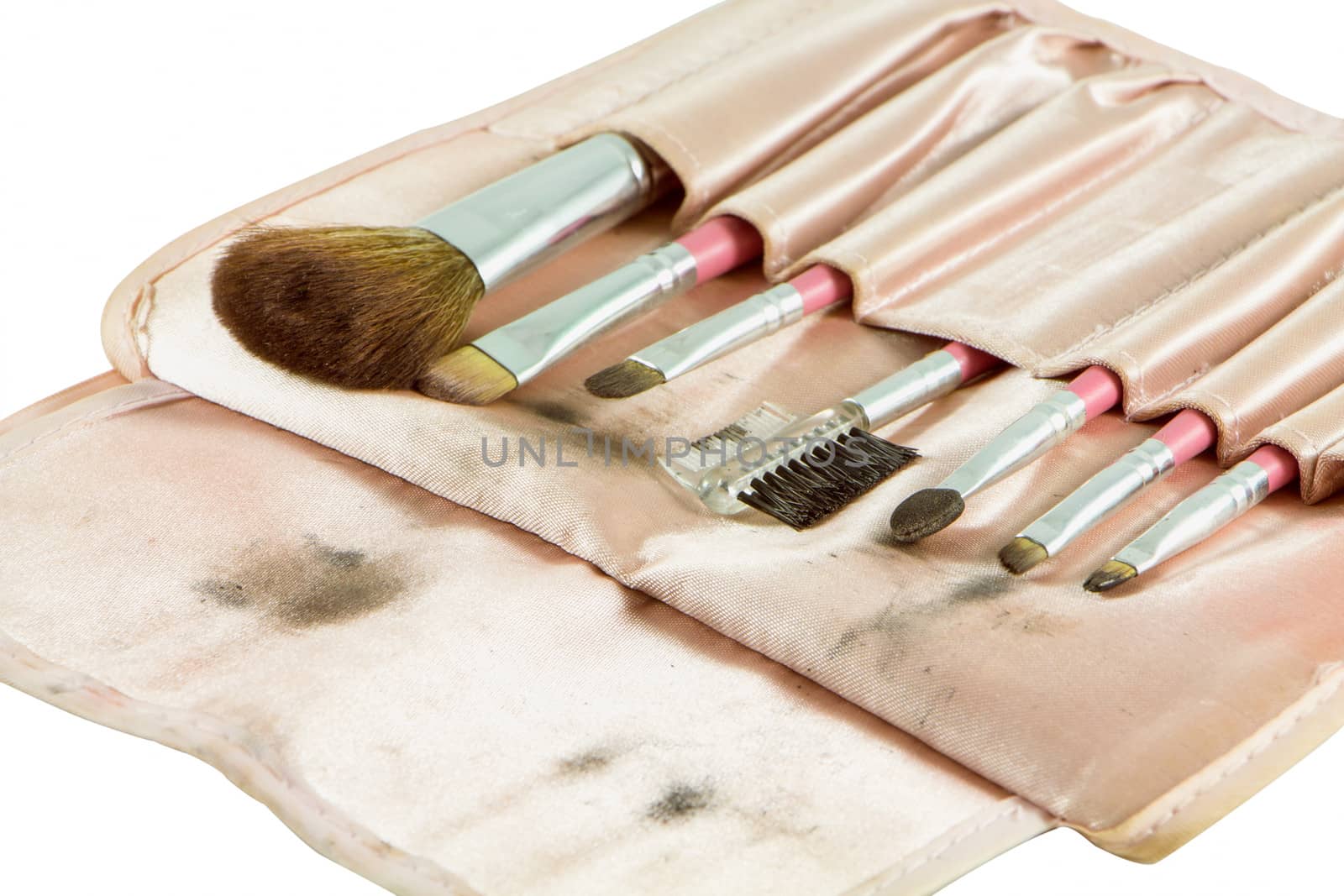Dirty cosmetic brushes isolate on a white background.