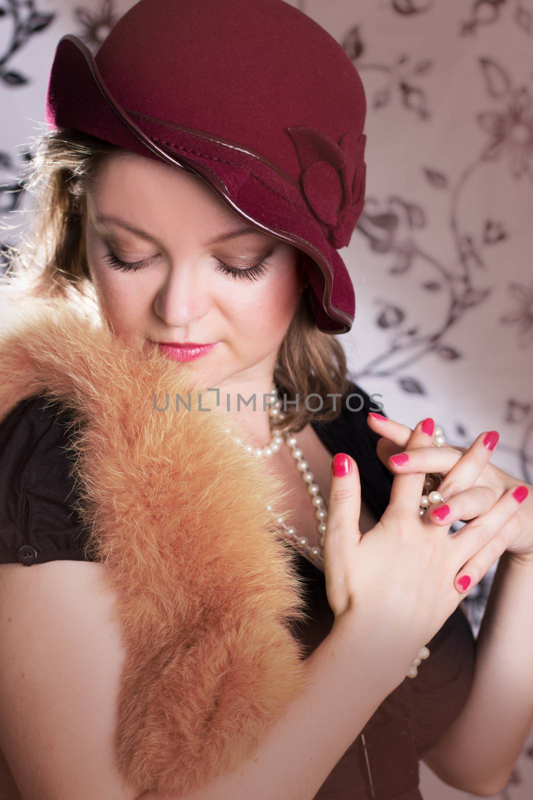 Retro woman in hat and boa with eyes closed over vintage back
