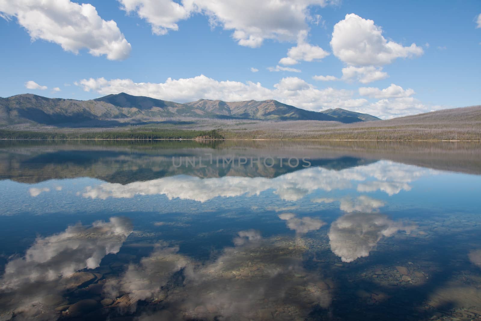 Taken at Glacier National Park in Montana. The water and the sky were so clear the reflections look life-like.