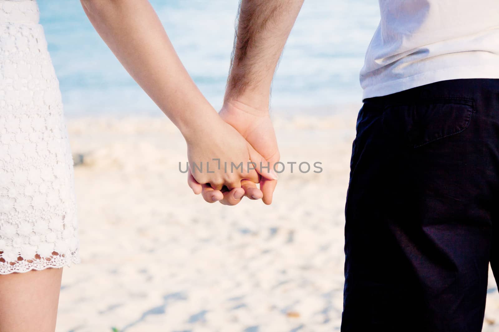 young happy couple in summer holiday vacation summertime beach