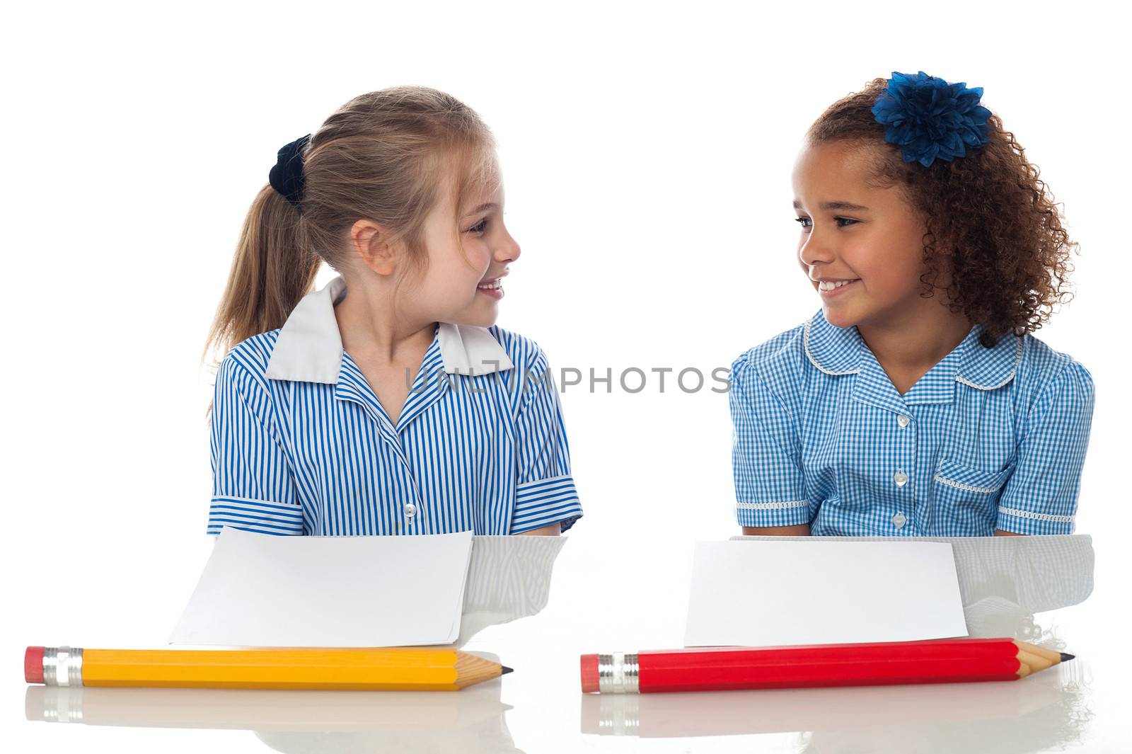 School girls in examination hall by stockyimages