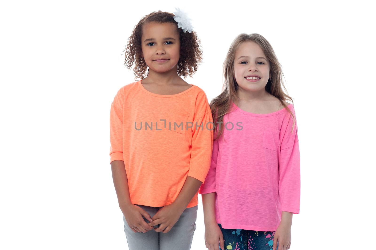 Two pretty young girls standing together