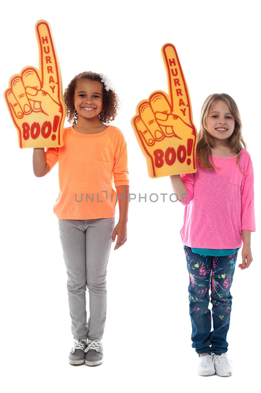 Cheerful girls each wearing big foam hand