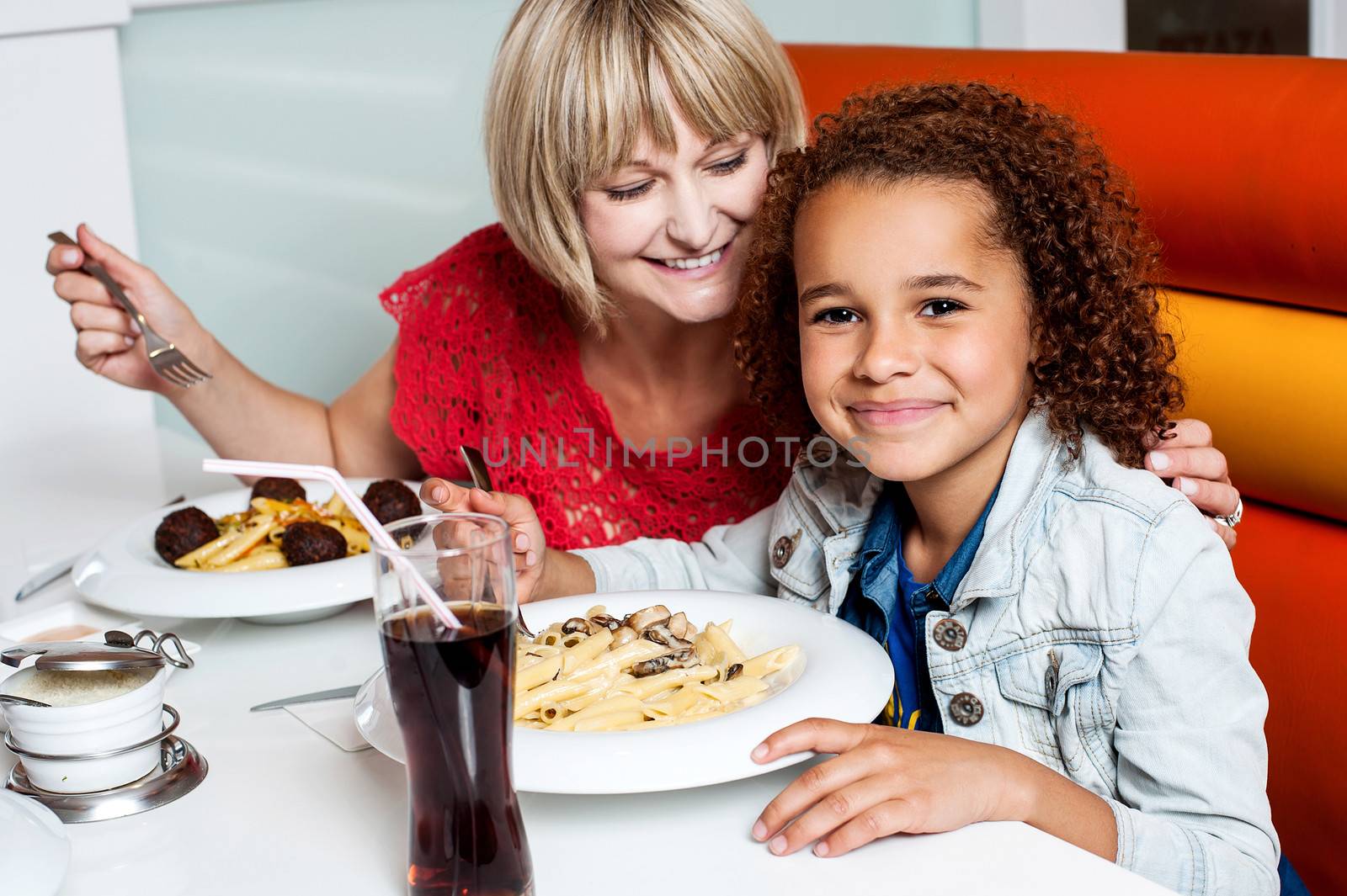 Daughter enjoying meal with her mother