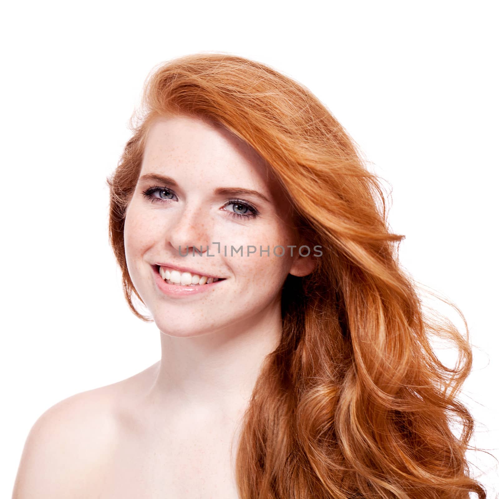 beautiful young redhead woman with freckles portrait isolated on white