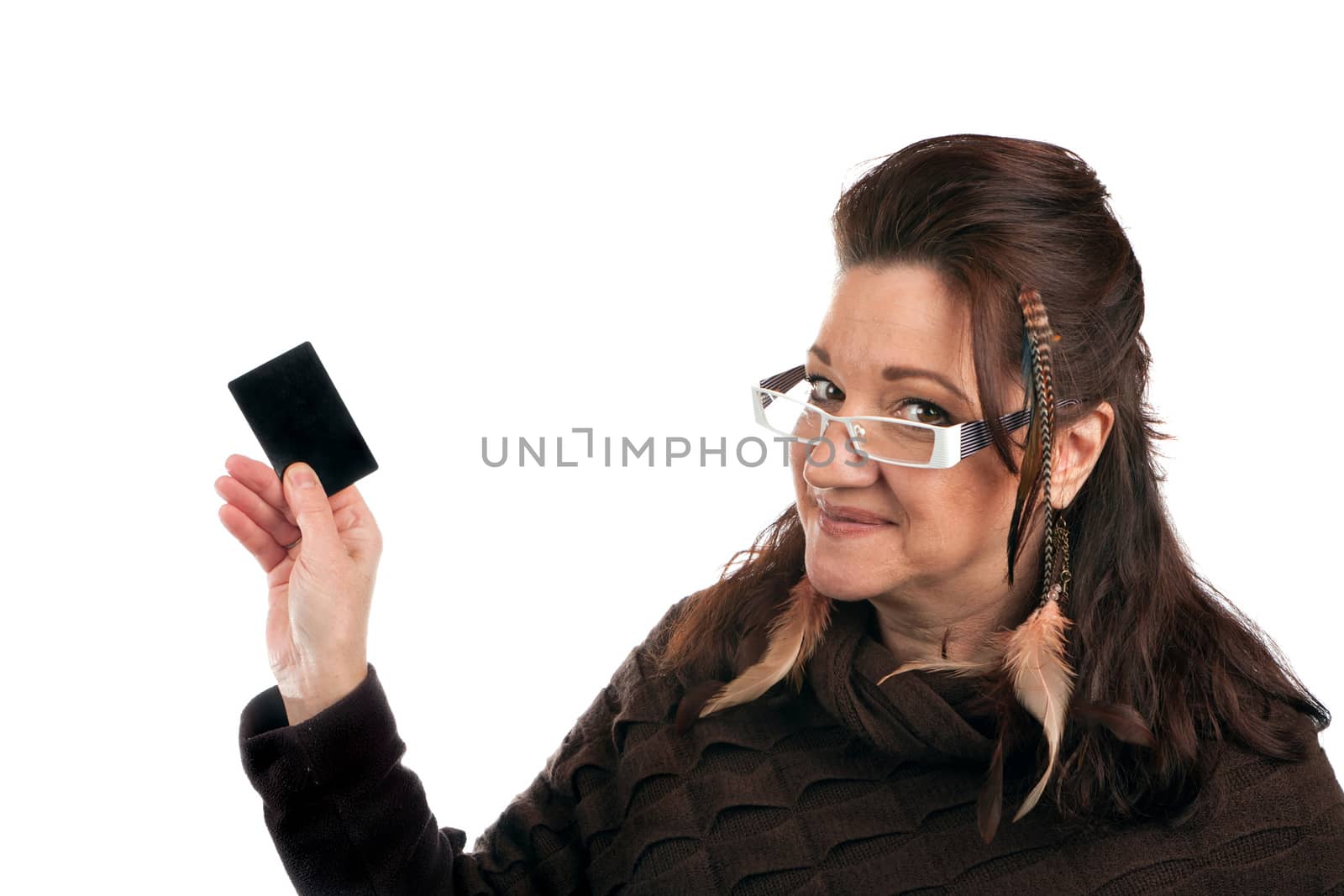 Brunette woman holding up a blank credit card business card shoppers club card or gift card of some sort with copyspace. 