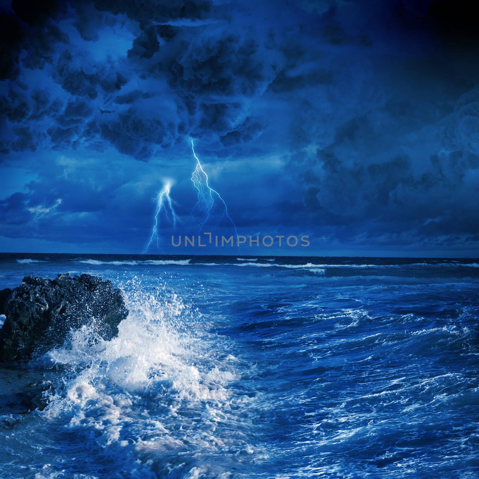 Image of night stormy sea with big waves and lightning