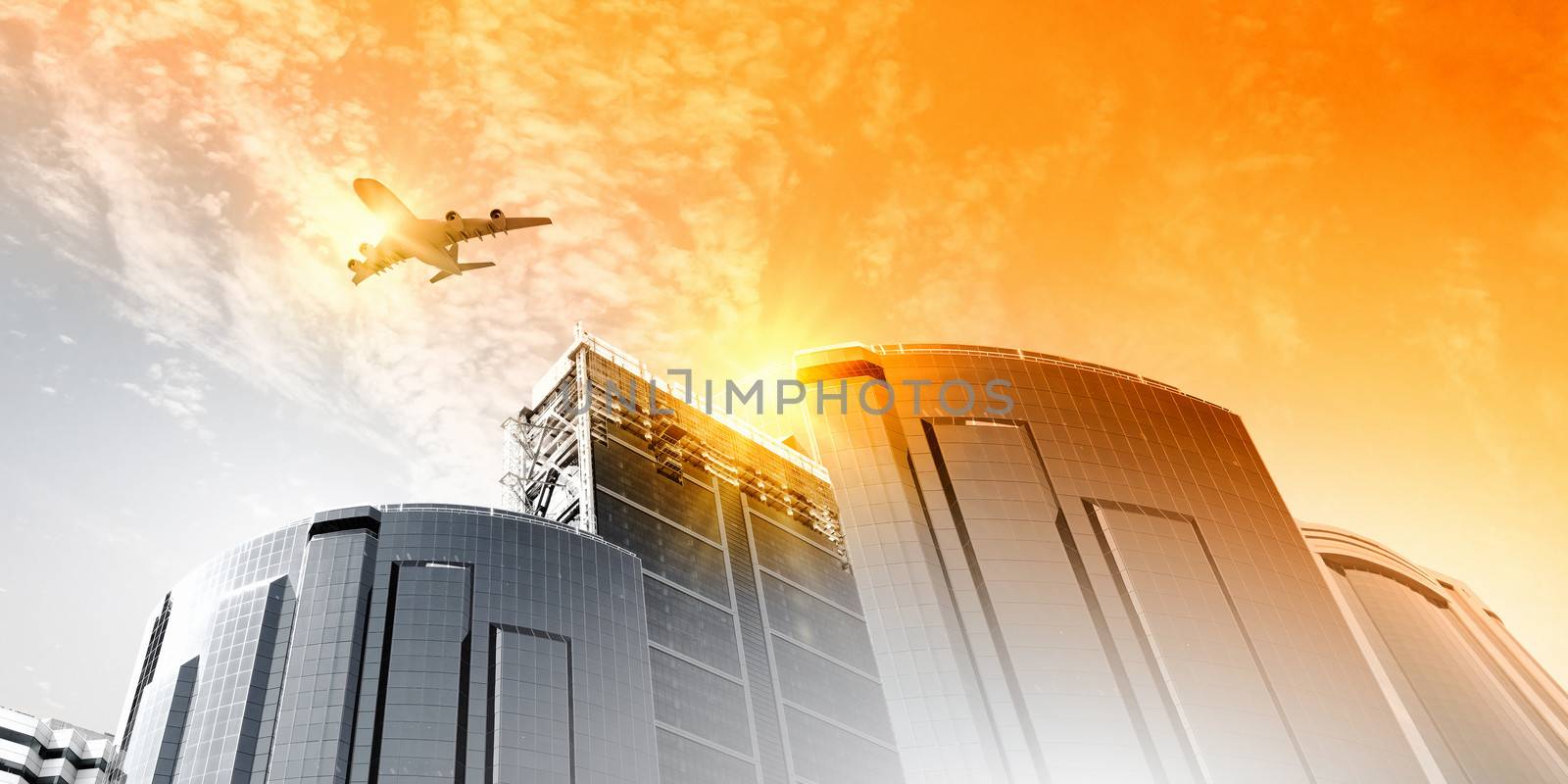 Plane flying above skyscrapers. Business travel concept