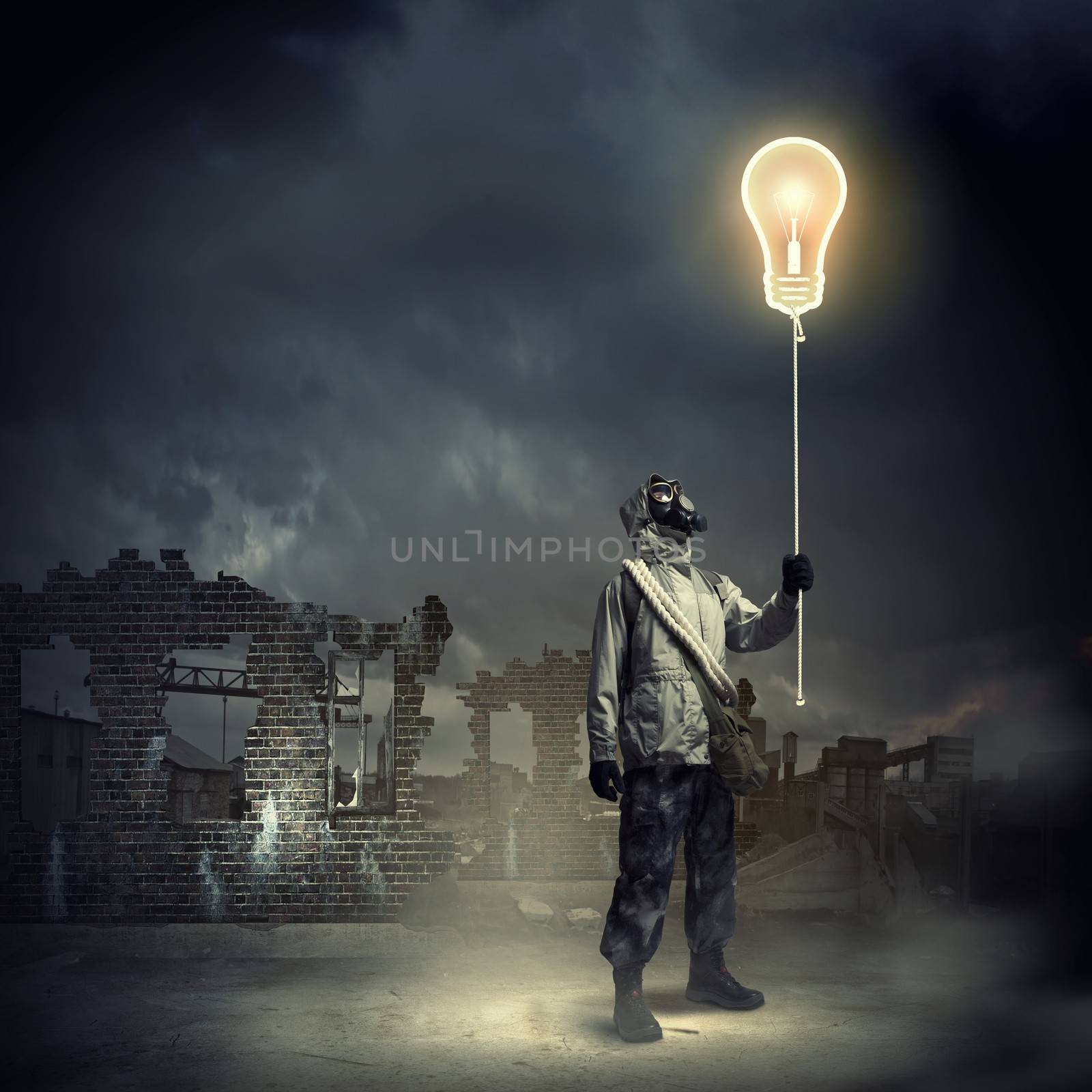 Man in respirator against nuclear background touching symbol. Pollution concept