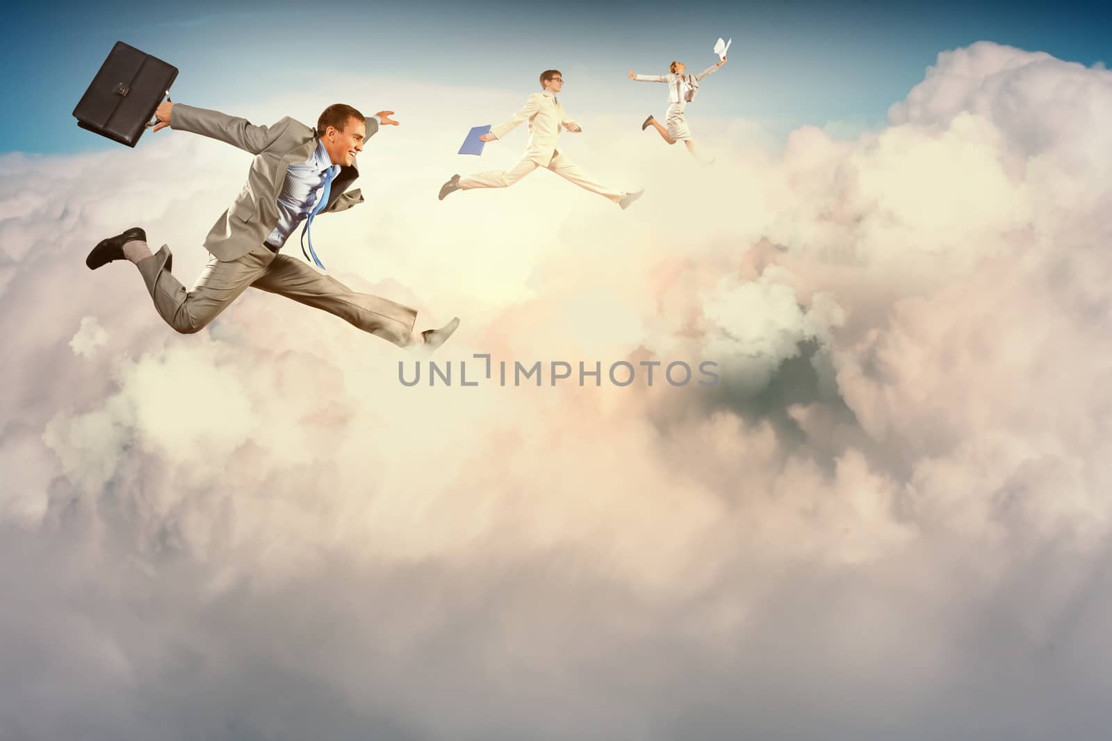 Image of businesspeople jumping high in sky