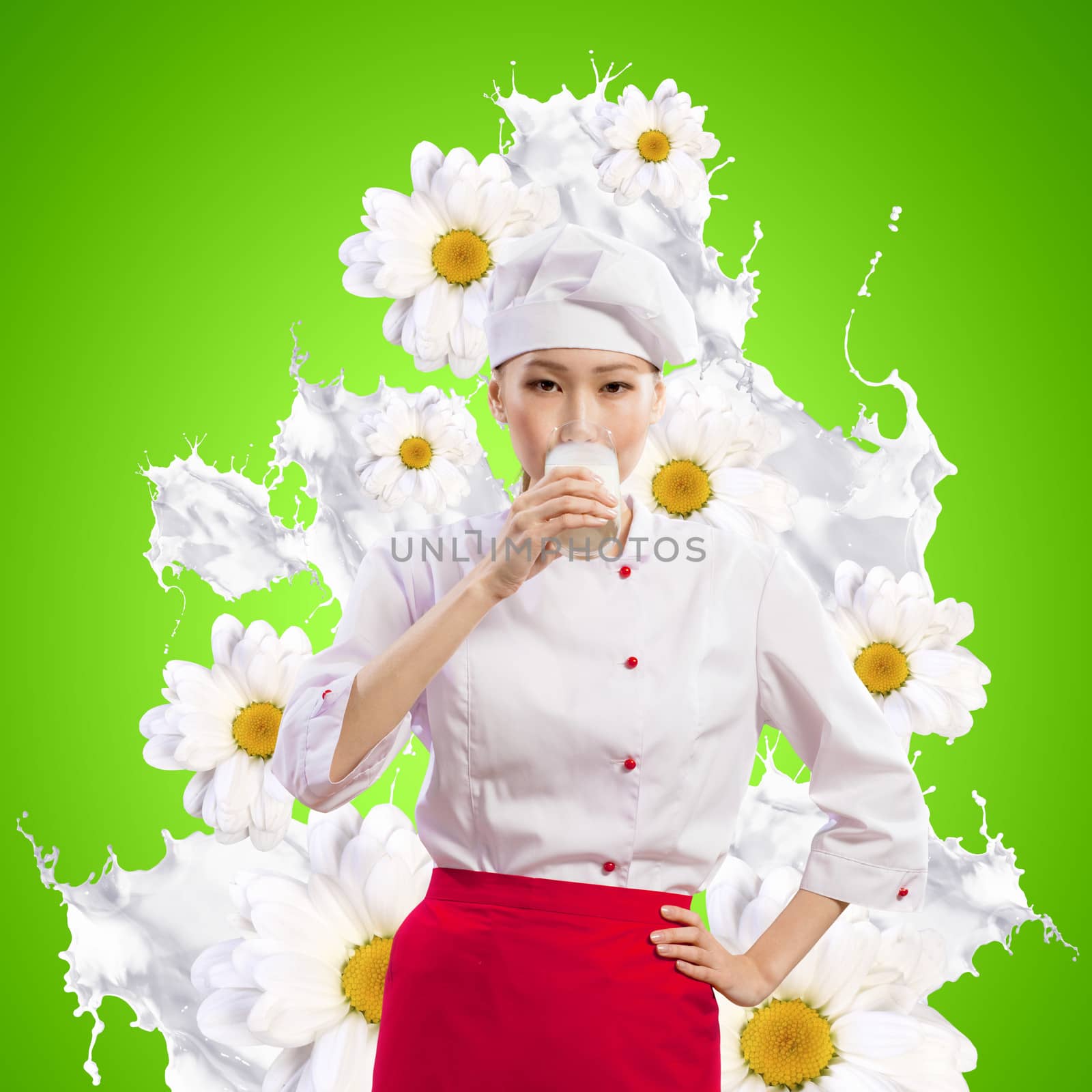 Asian female cook against milk splashes in red apron against flower background drinking milk