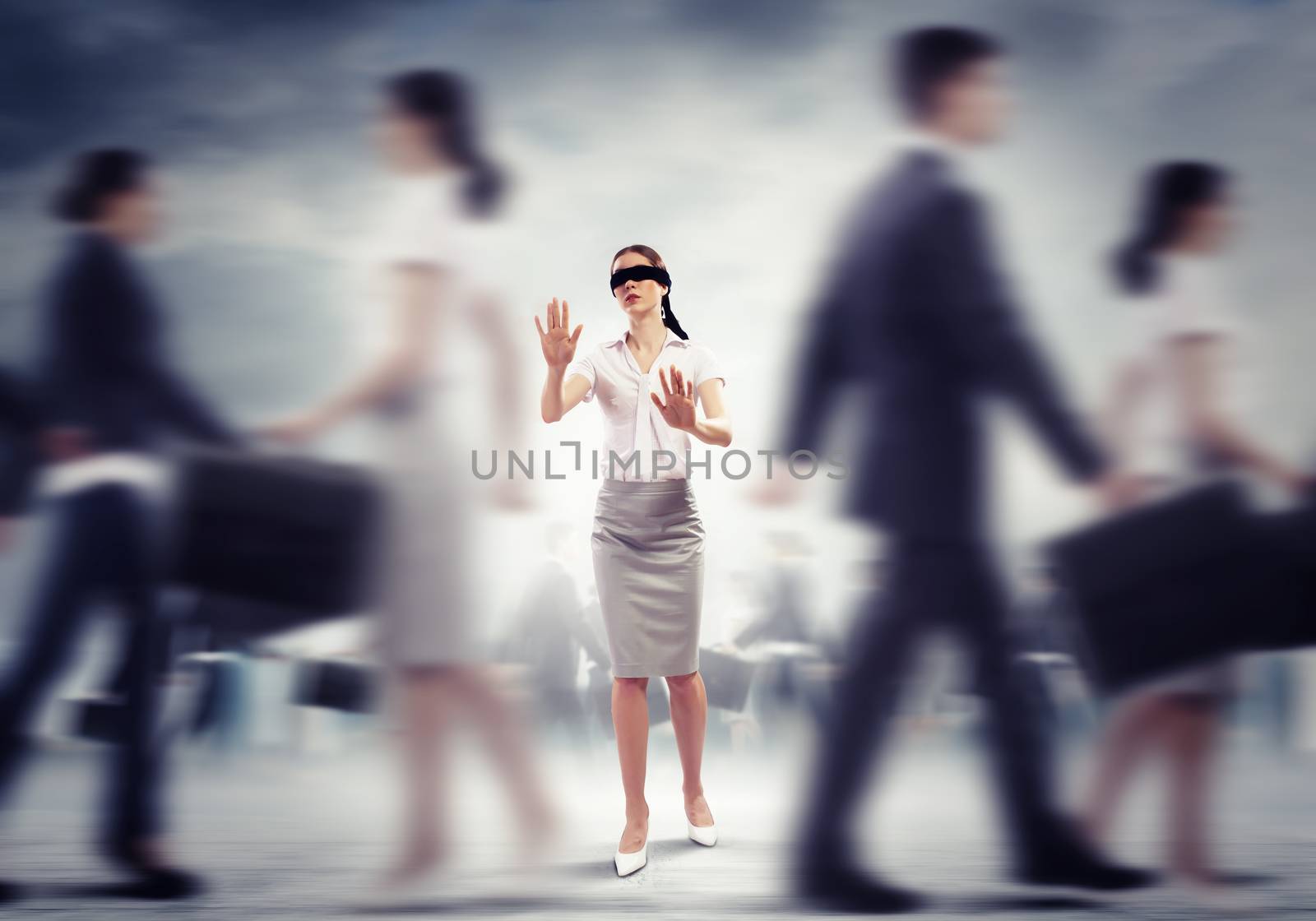 Image of businesswoman in blindfold walking among group of people