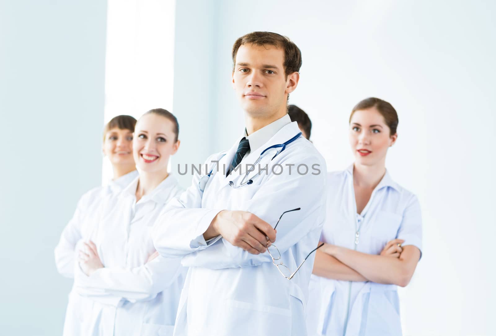 team of experienced highly qualified doctors, fold one's arms