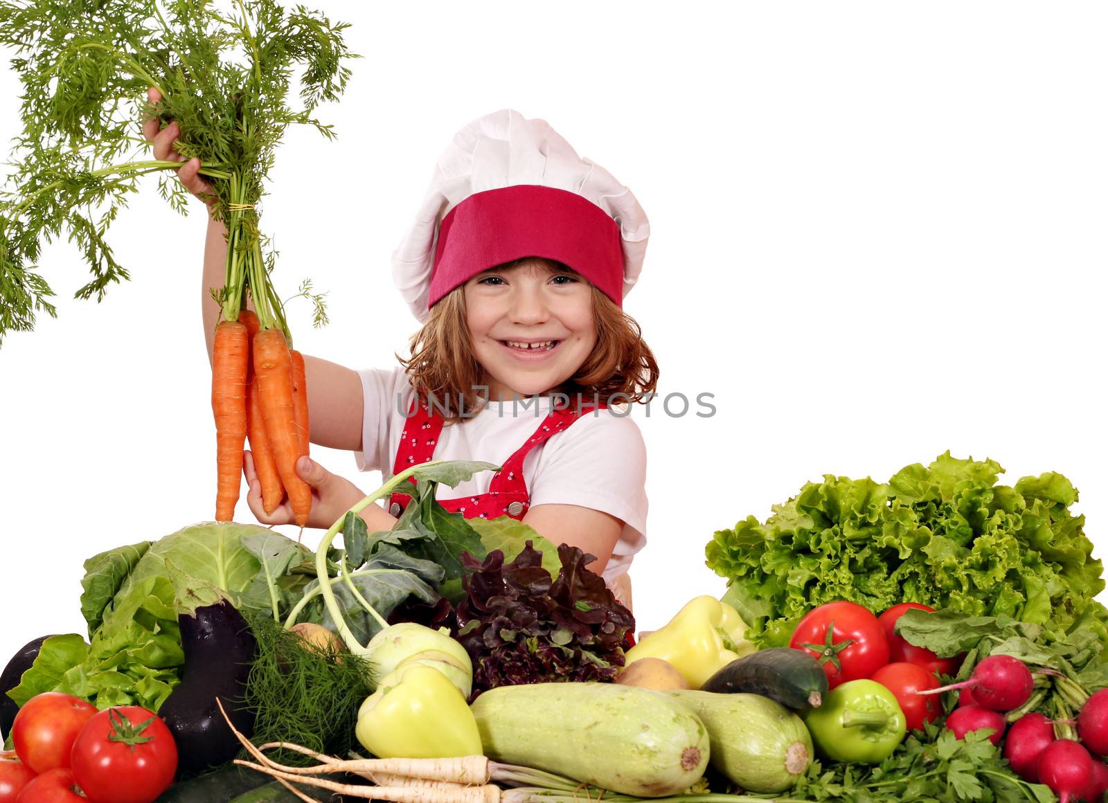 happy little girl cook holding carrot 