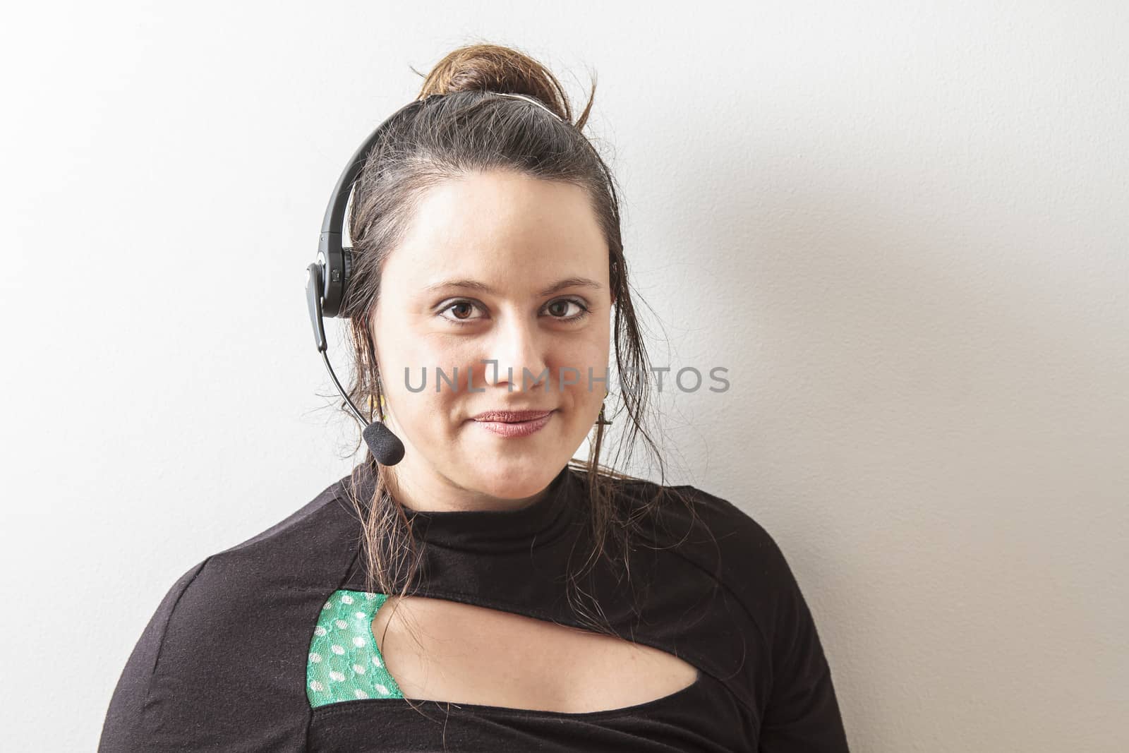 brunet woman with headset against white background